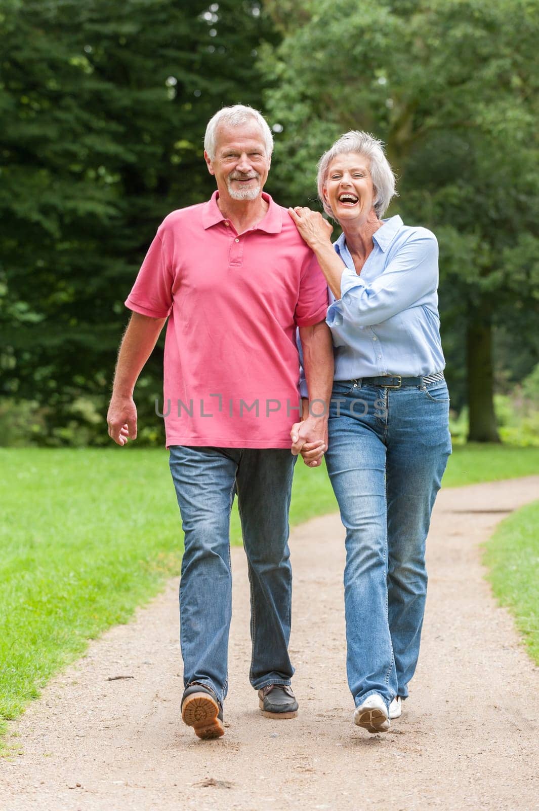 Attractive retired couple on a trip in a park