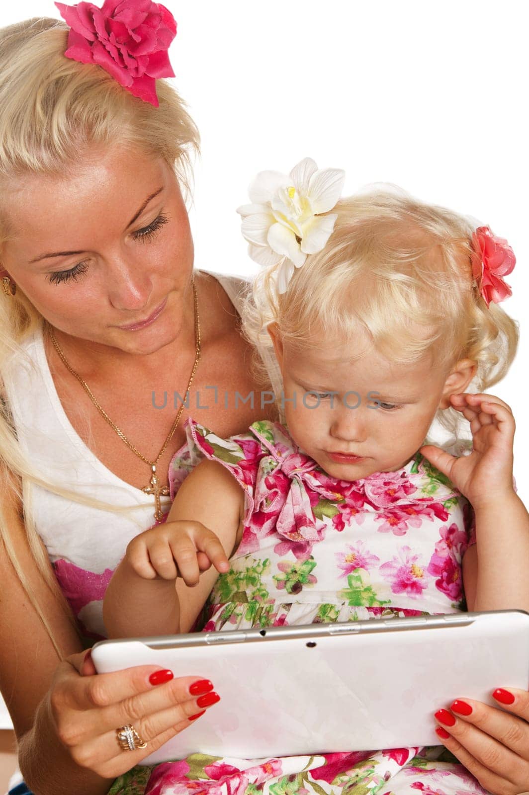 mother and daughter looking tablet, isolated on white
