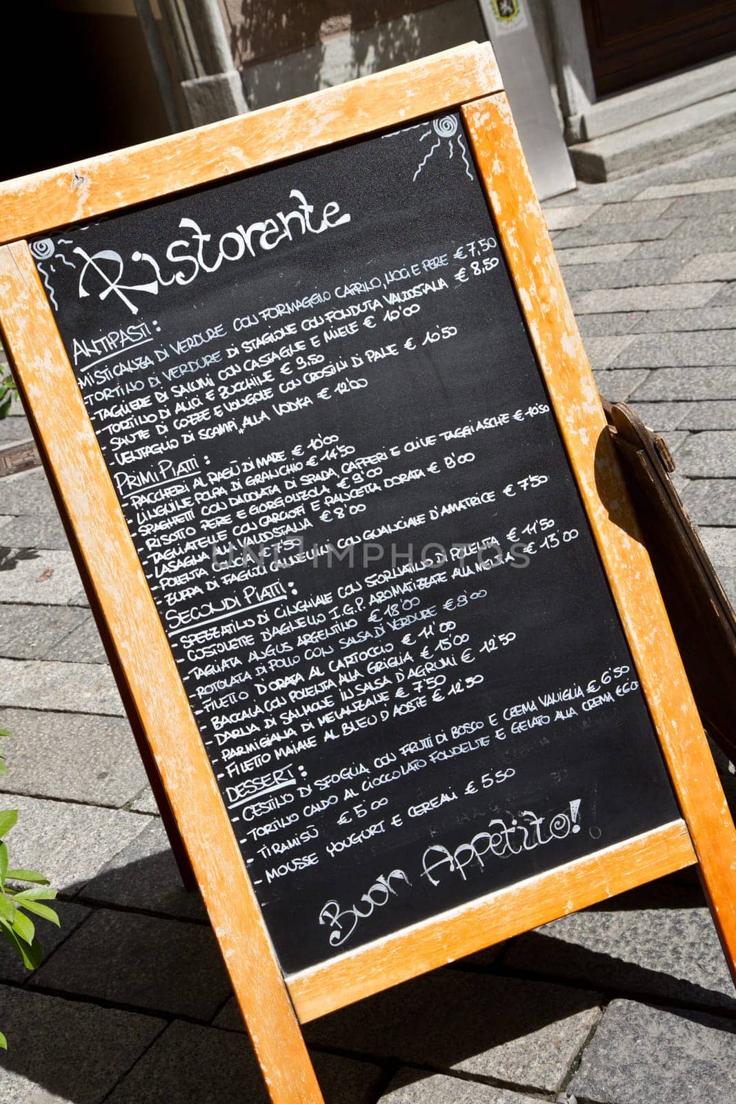 a wooden menu with different food