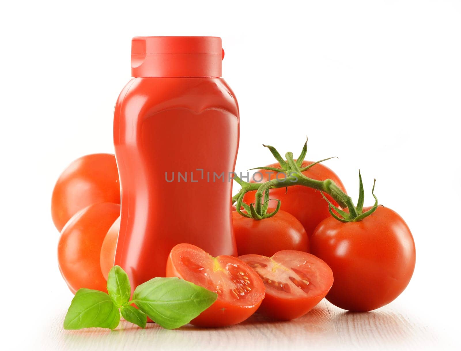 Composition with ketchup and fresh tomatoes isolated on white