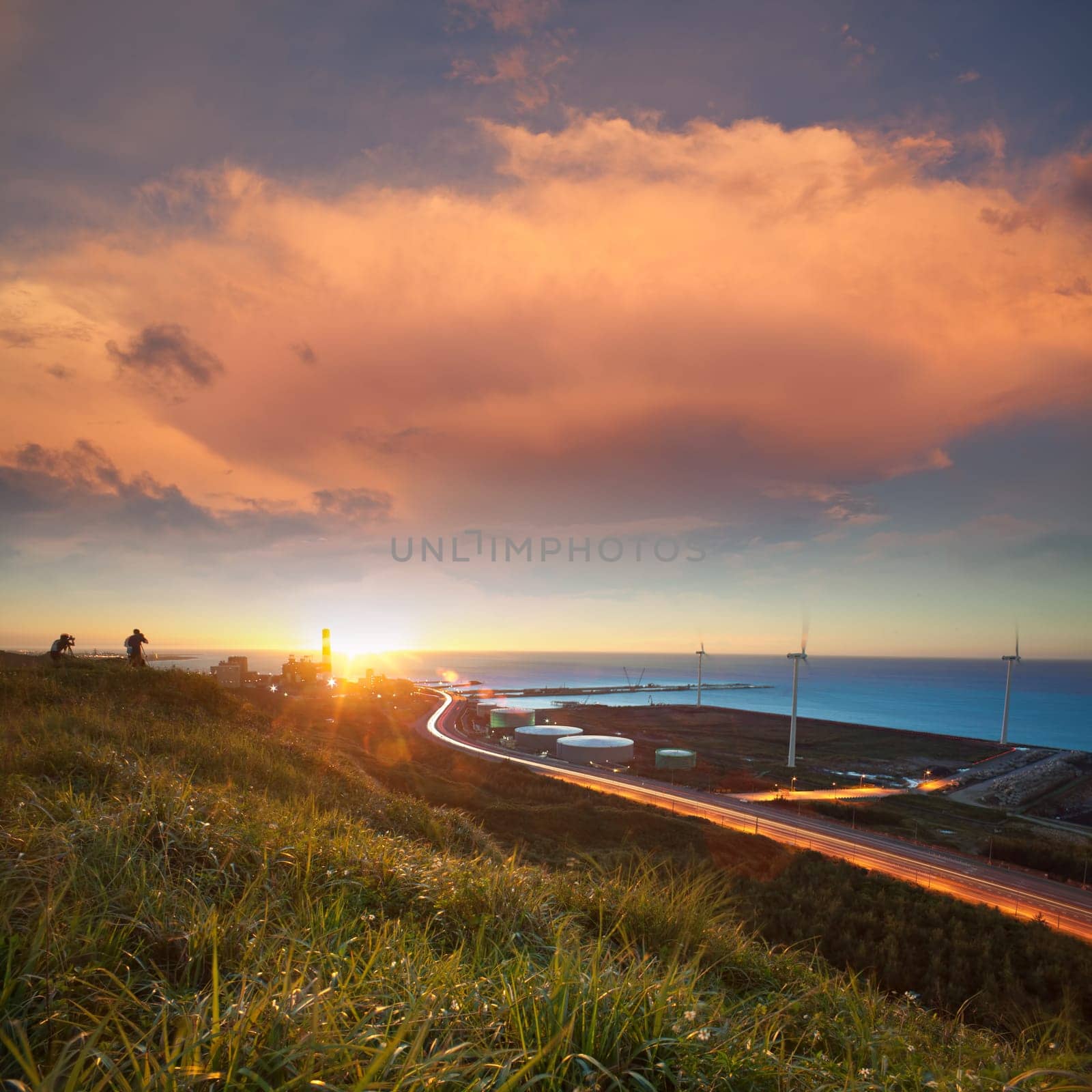 A road and windmills during sunset, made with a wide angle lens