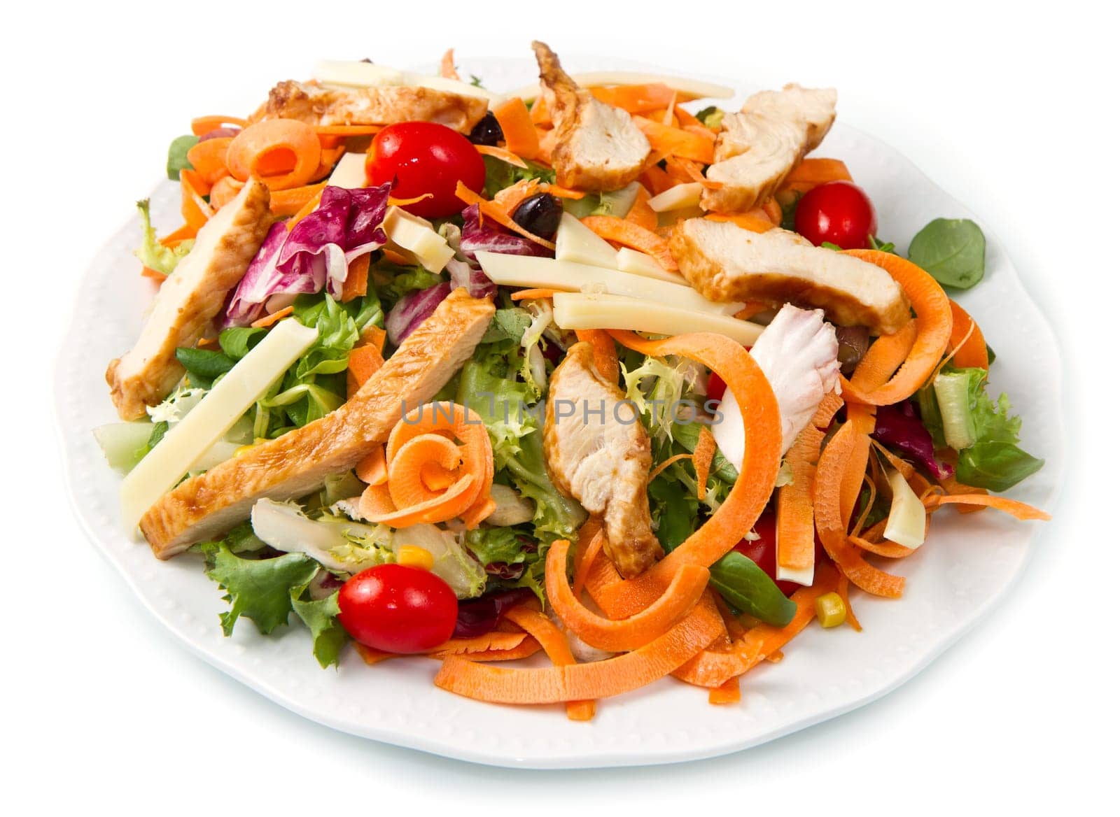 Chicken salad with fresh ingredients in the white bowl