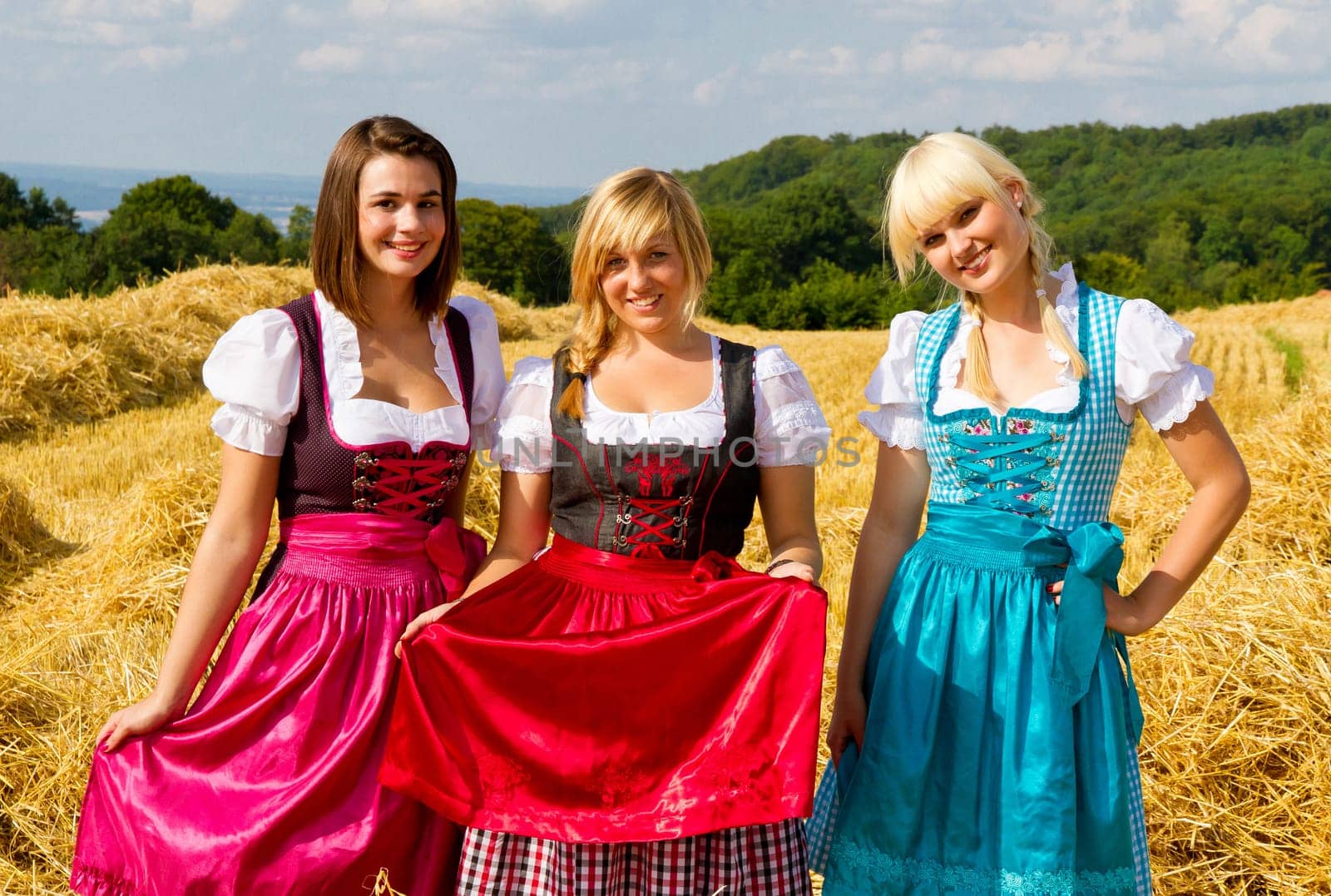 Three girls in dirndls