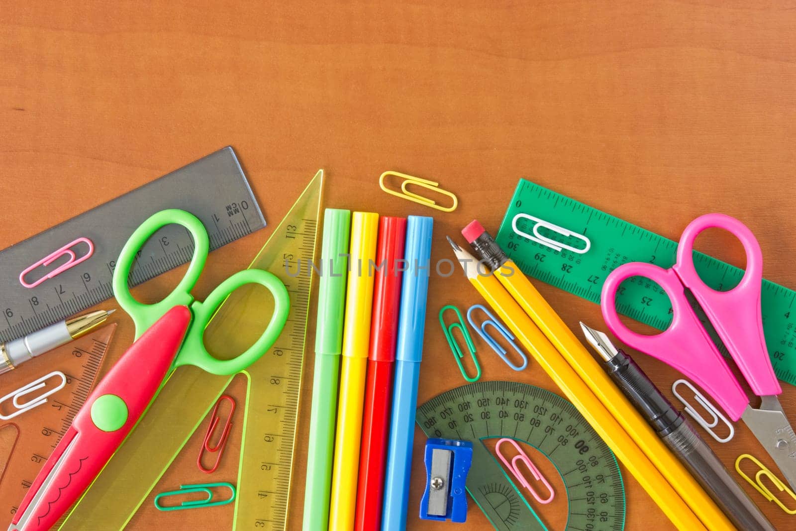 various school supplies on the wooden table