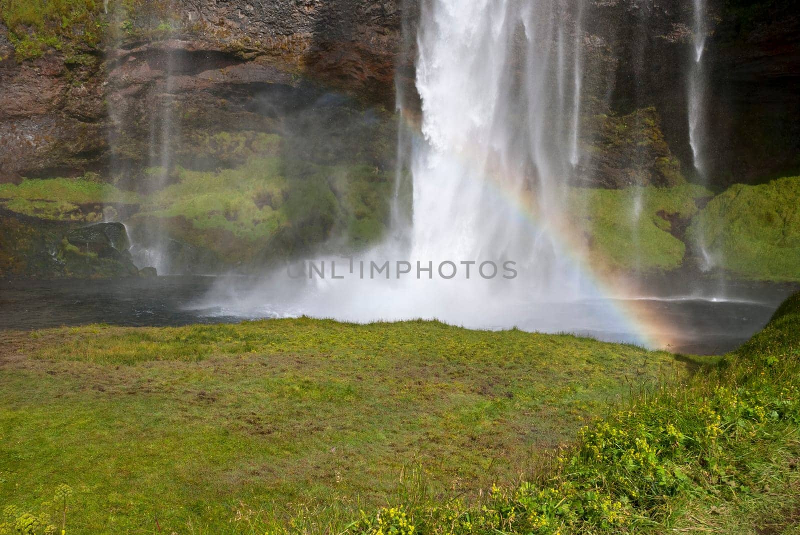 Seljalandsfoss waterfall with rainbow in Iceland