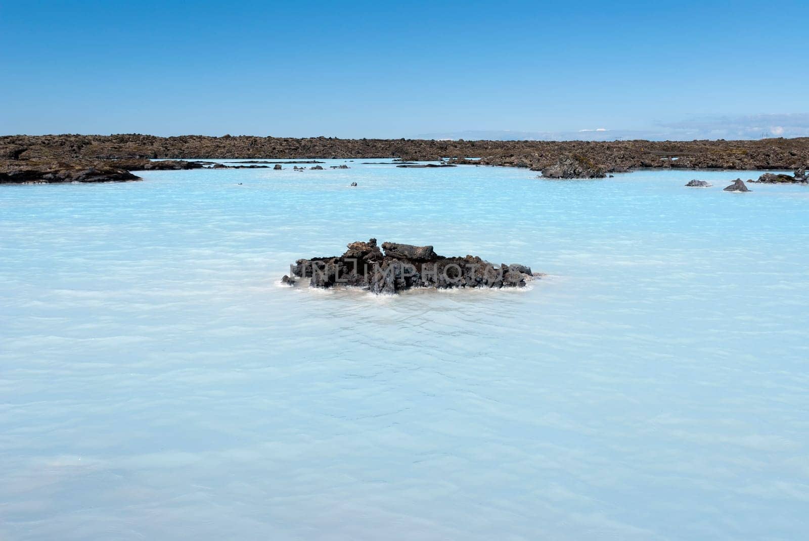 lake of boiling water over the blue lagoon in Iceland