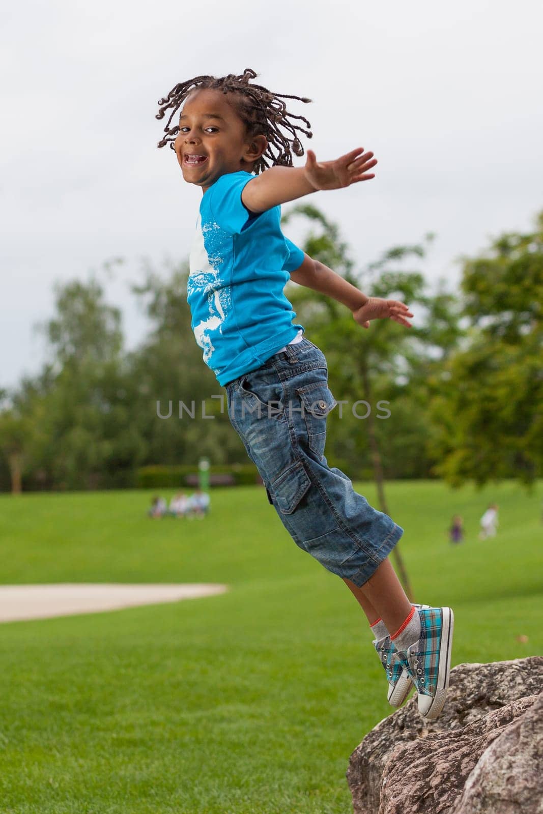 Outdoor portrait of a cute african american little boy