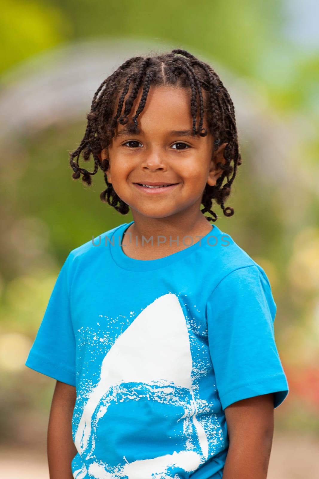 Outdoor portrait of a cute african american little boy