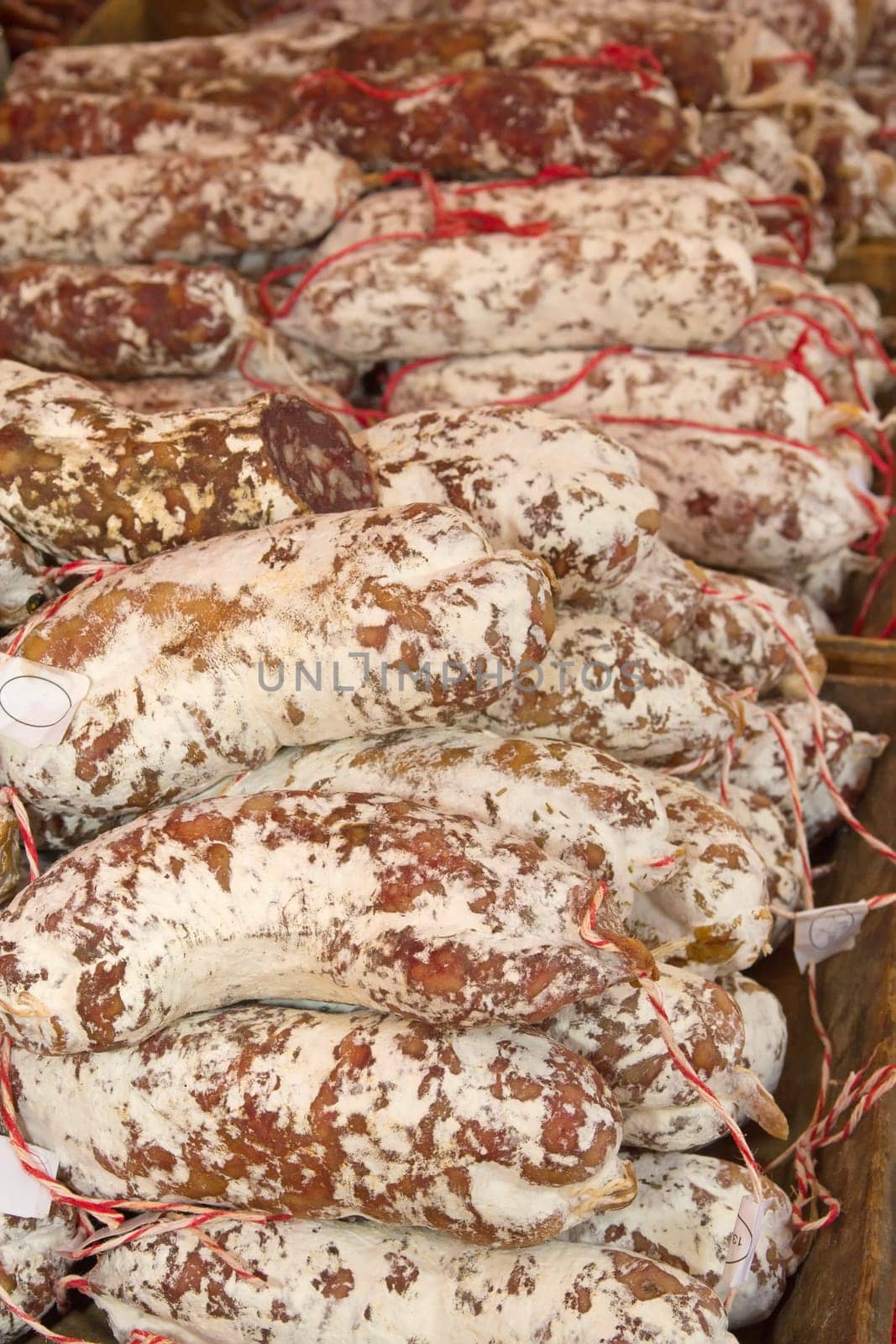 Sausages ready for sale on the market. (Arles, Provence, France). Vertically.