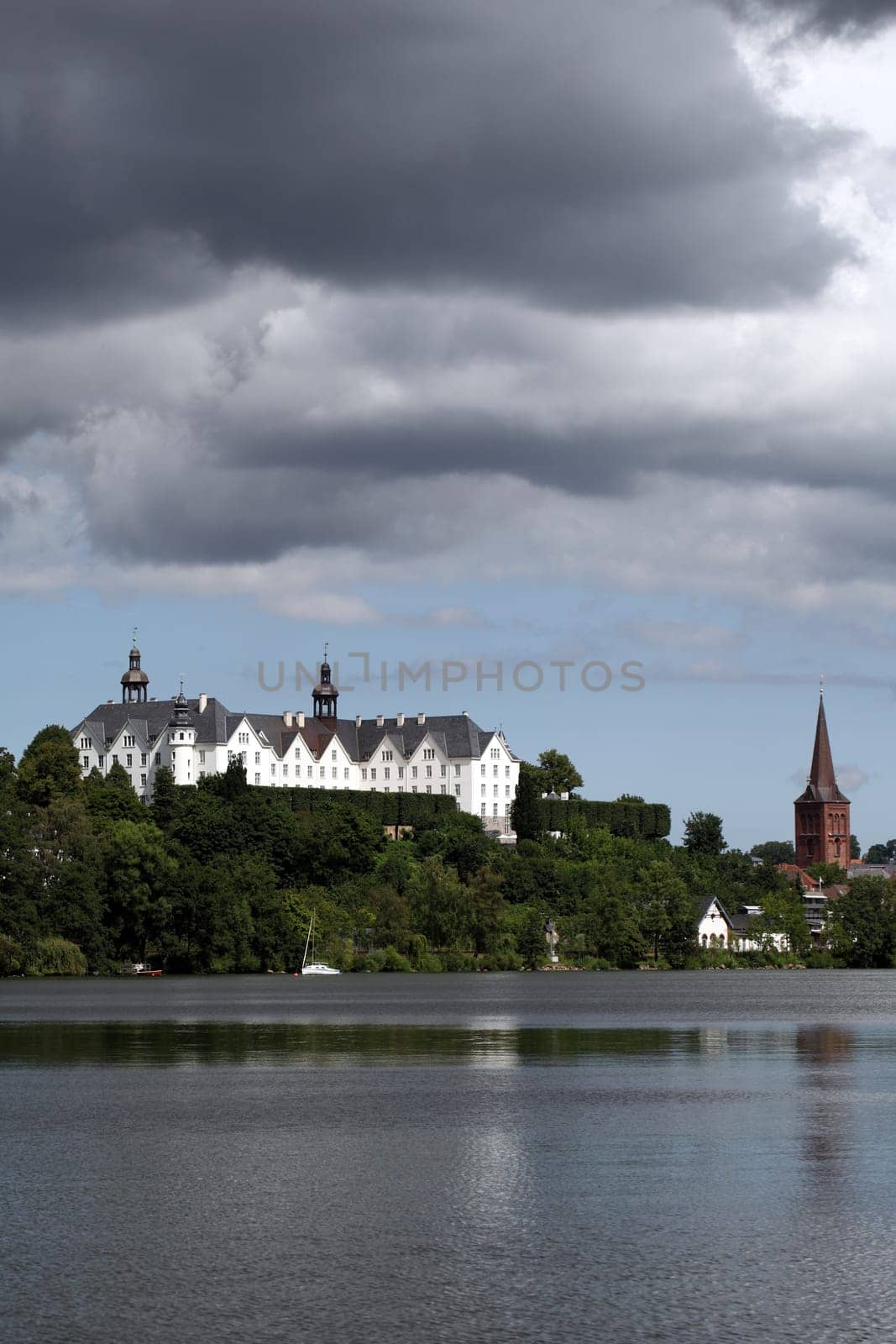 Plön Castle with Lake,Church Tower and Clouds - Schleswig-Holstein