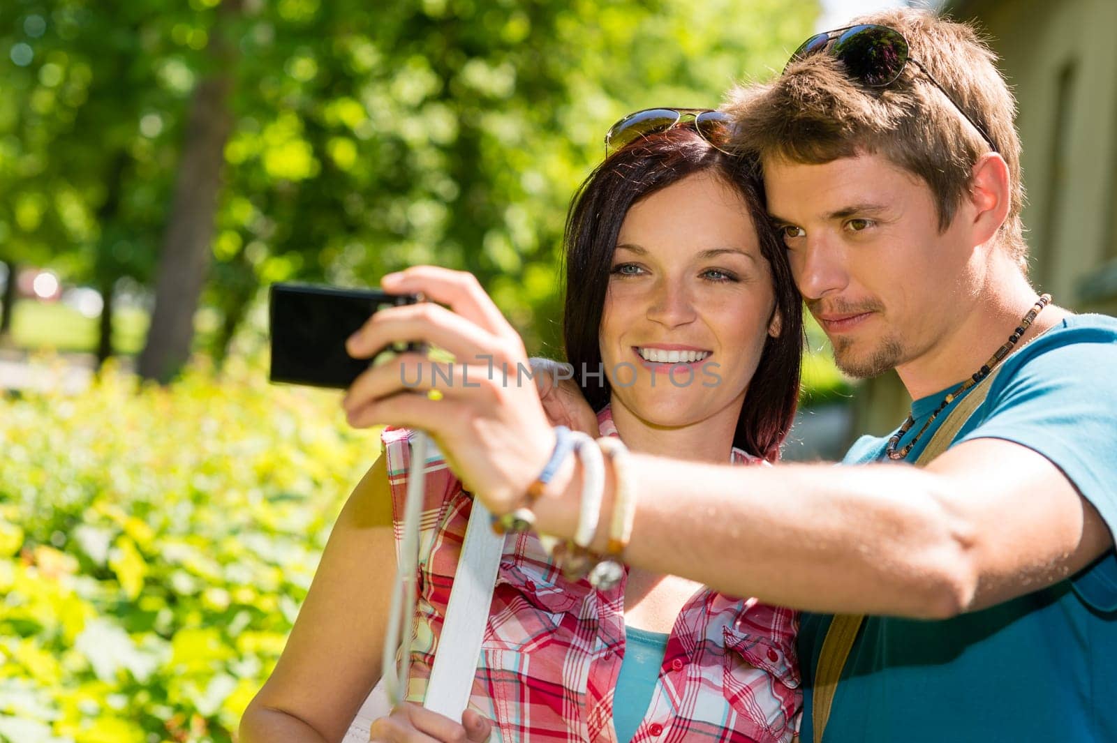 Young couple in love take picture of themselves outdoor
