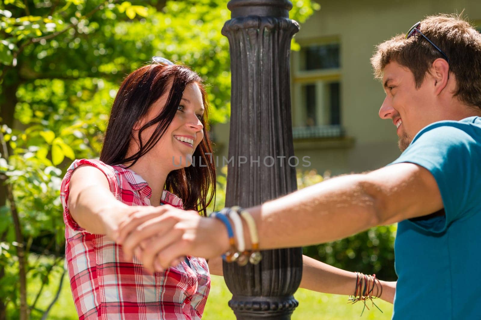 Happy young couple smiling at each other with love