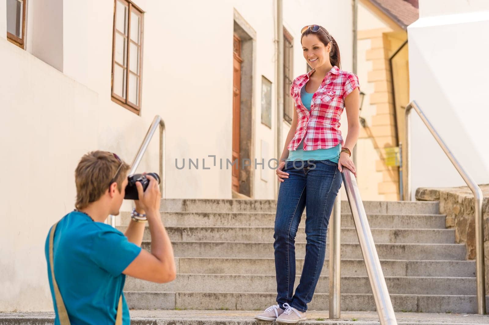 Young couple visit city take photos sightseeing tourist