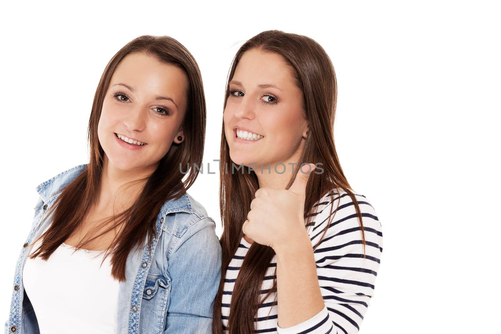 Happy teenagers showing thumbs up on white background