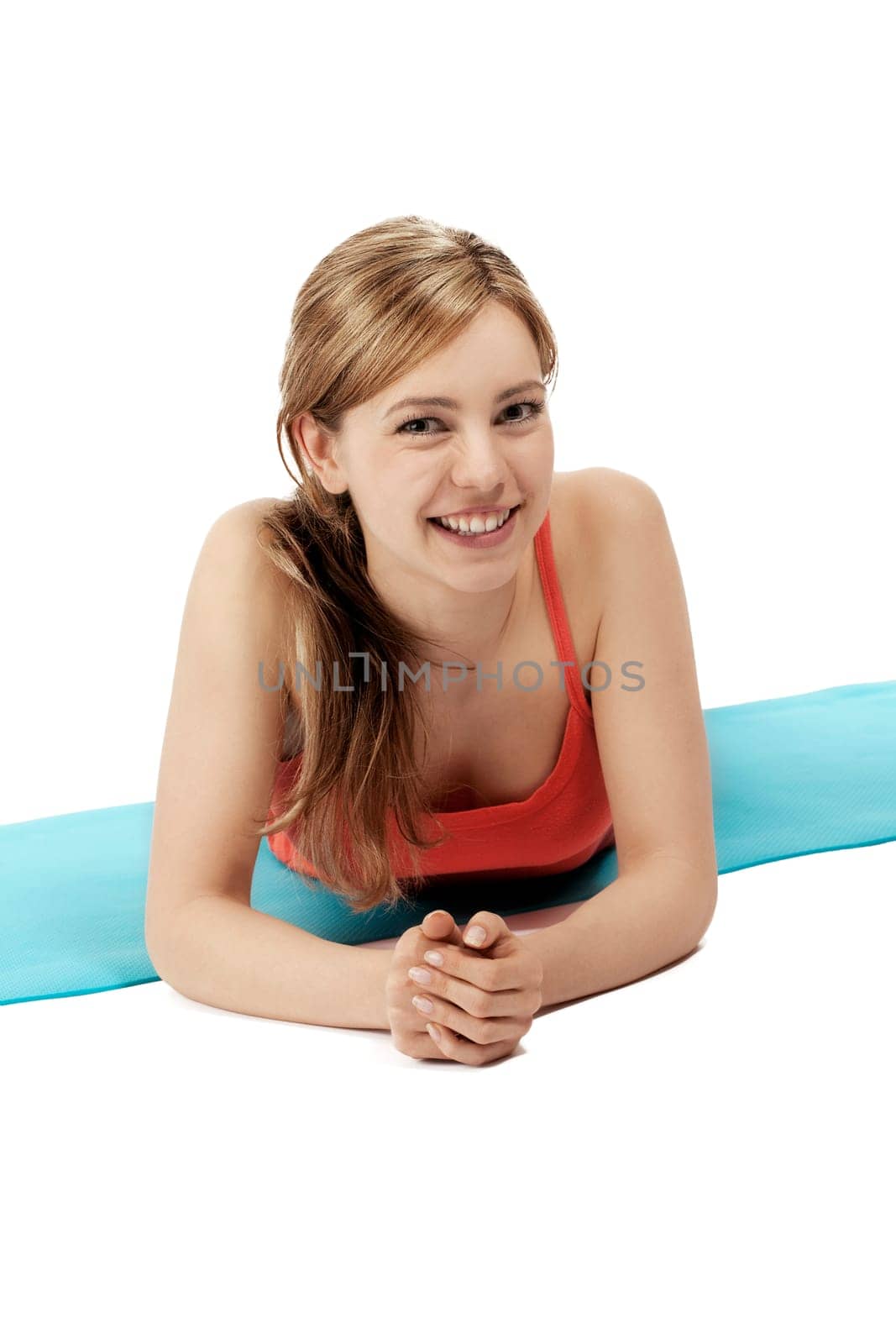 Pretty sportswoman lying on her fitness mat on white background