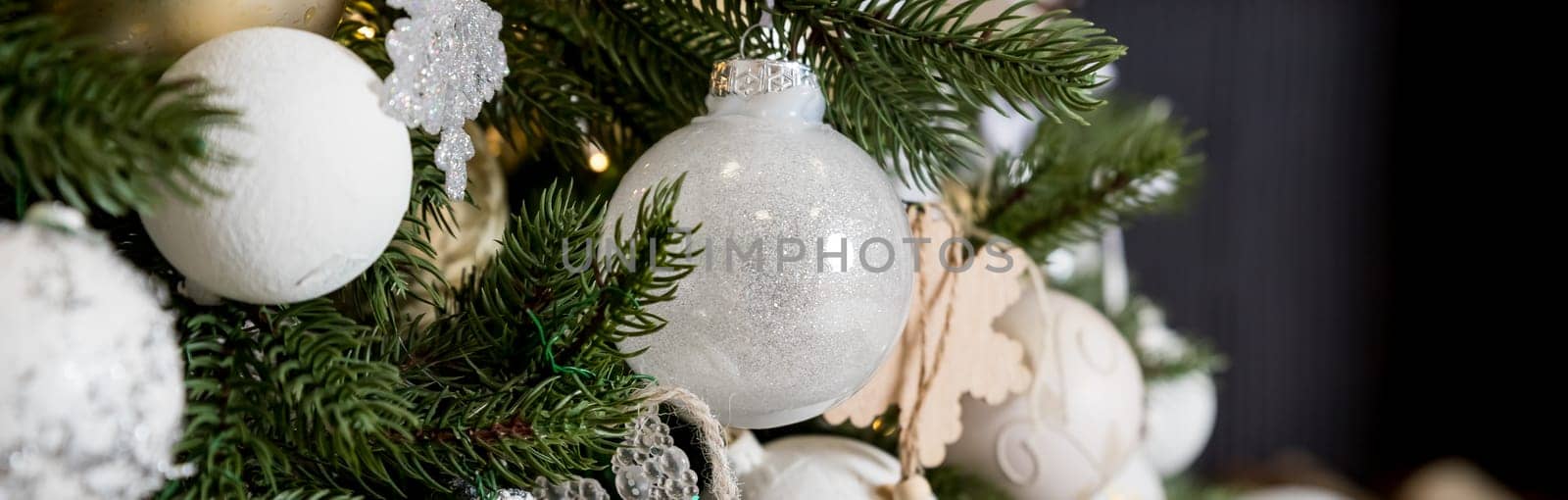 Handmade Christmas tree decoration hanging on Xmas tree with dried apple, leather, and wooden toys.