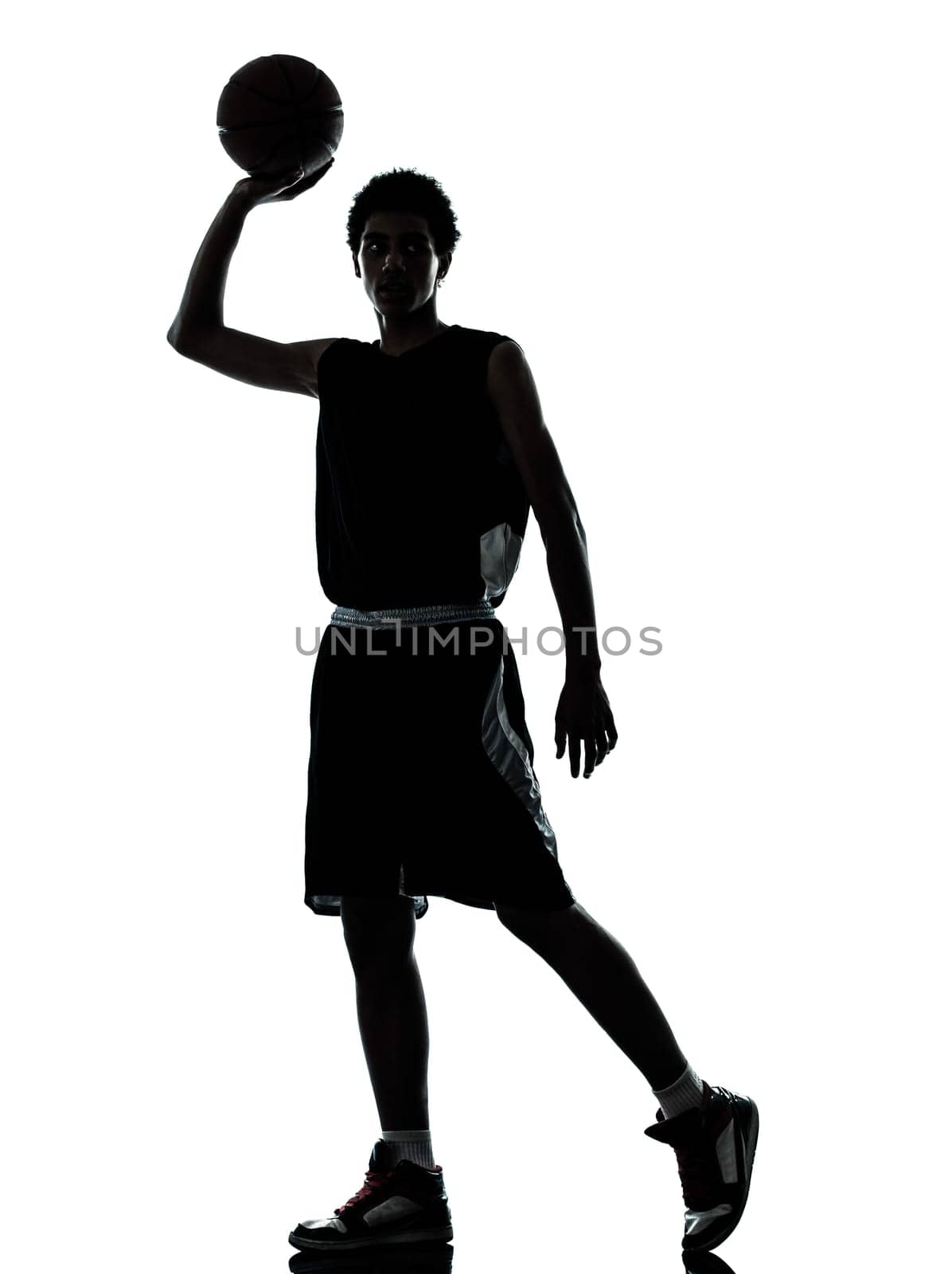one young man basketball player silhouette in studio isolated on white background