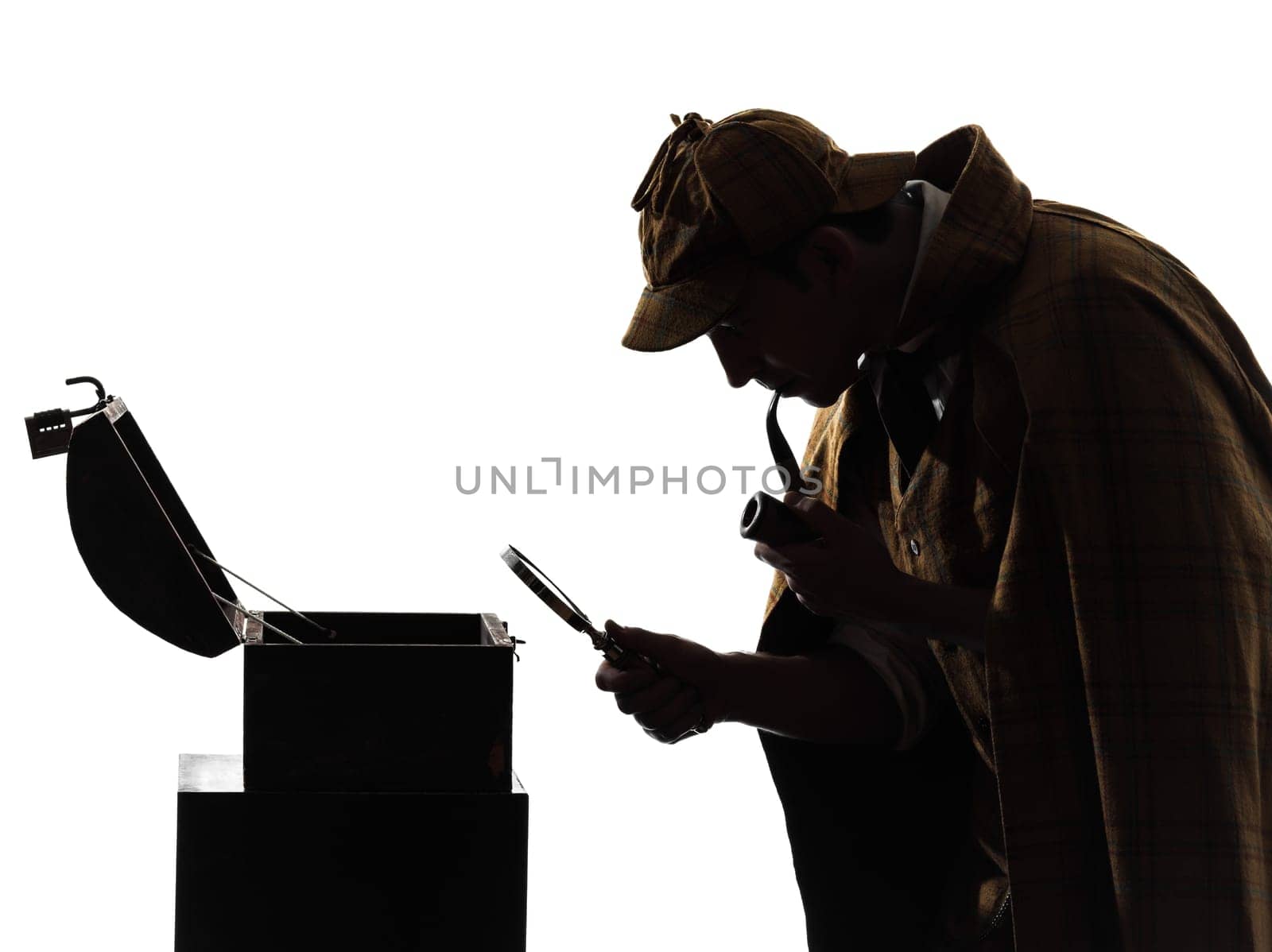 sherlock holmes looking at open safe silhouette in studio on white background