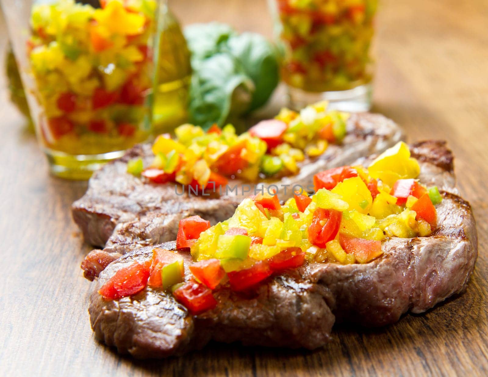 grilled steak meat with cut vegetables