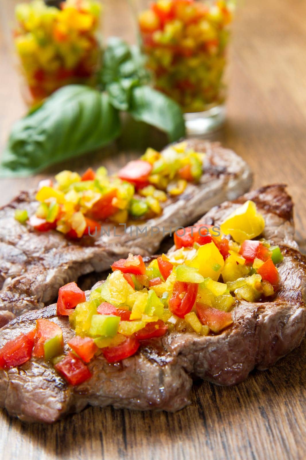 grilled steak meat with cut vegetables
