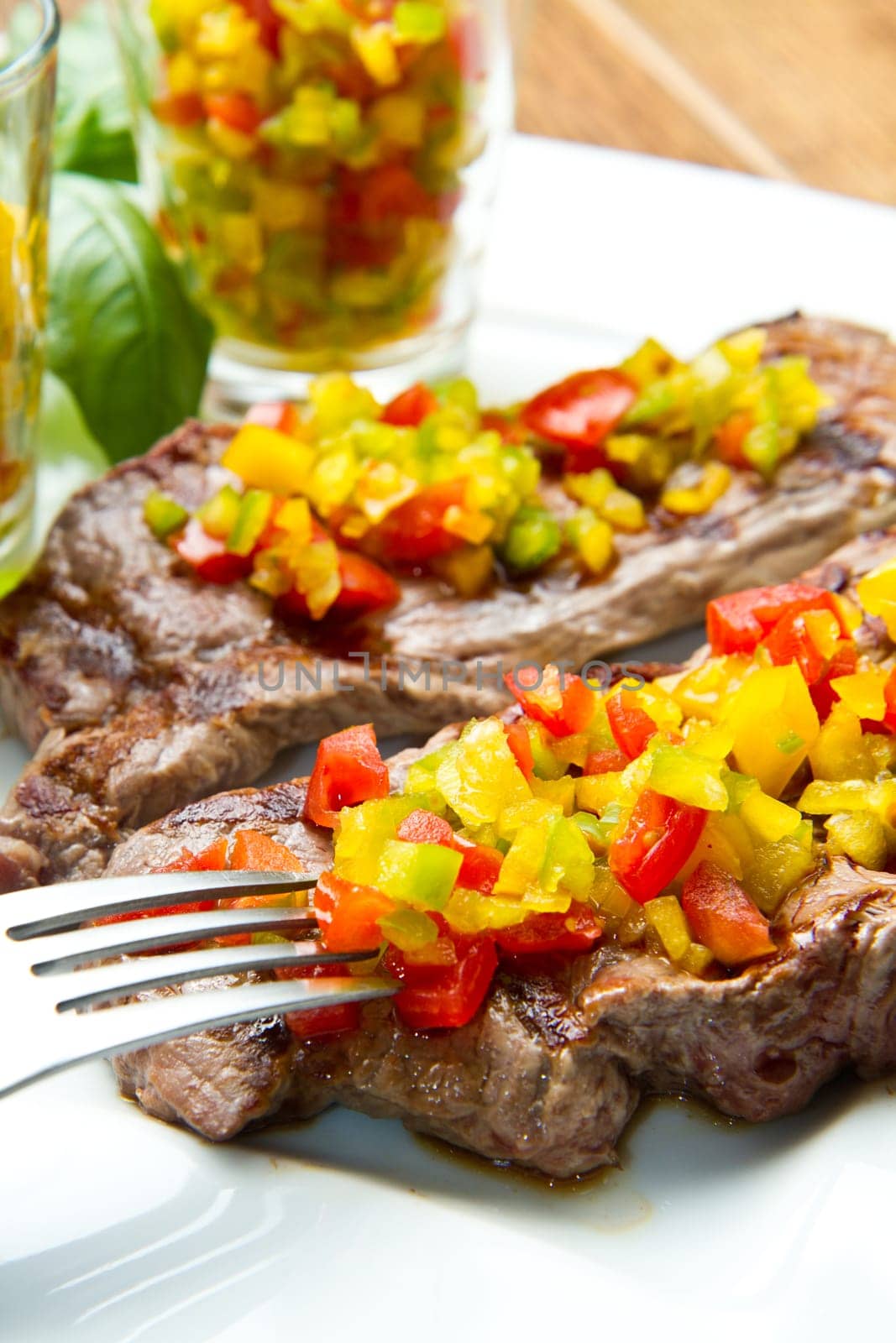 grilled steak meat with cut vegetables