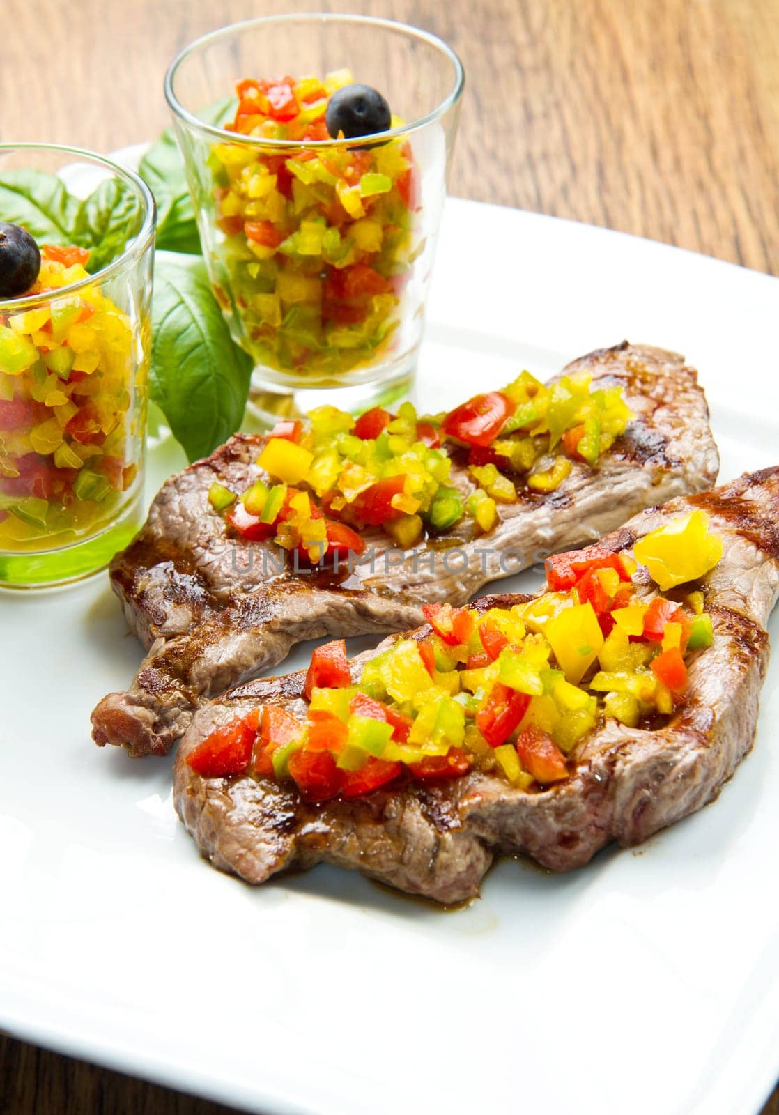 grilled steak meat with cut vegetables