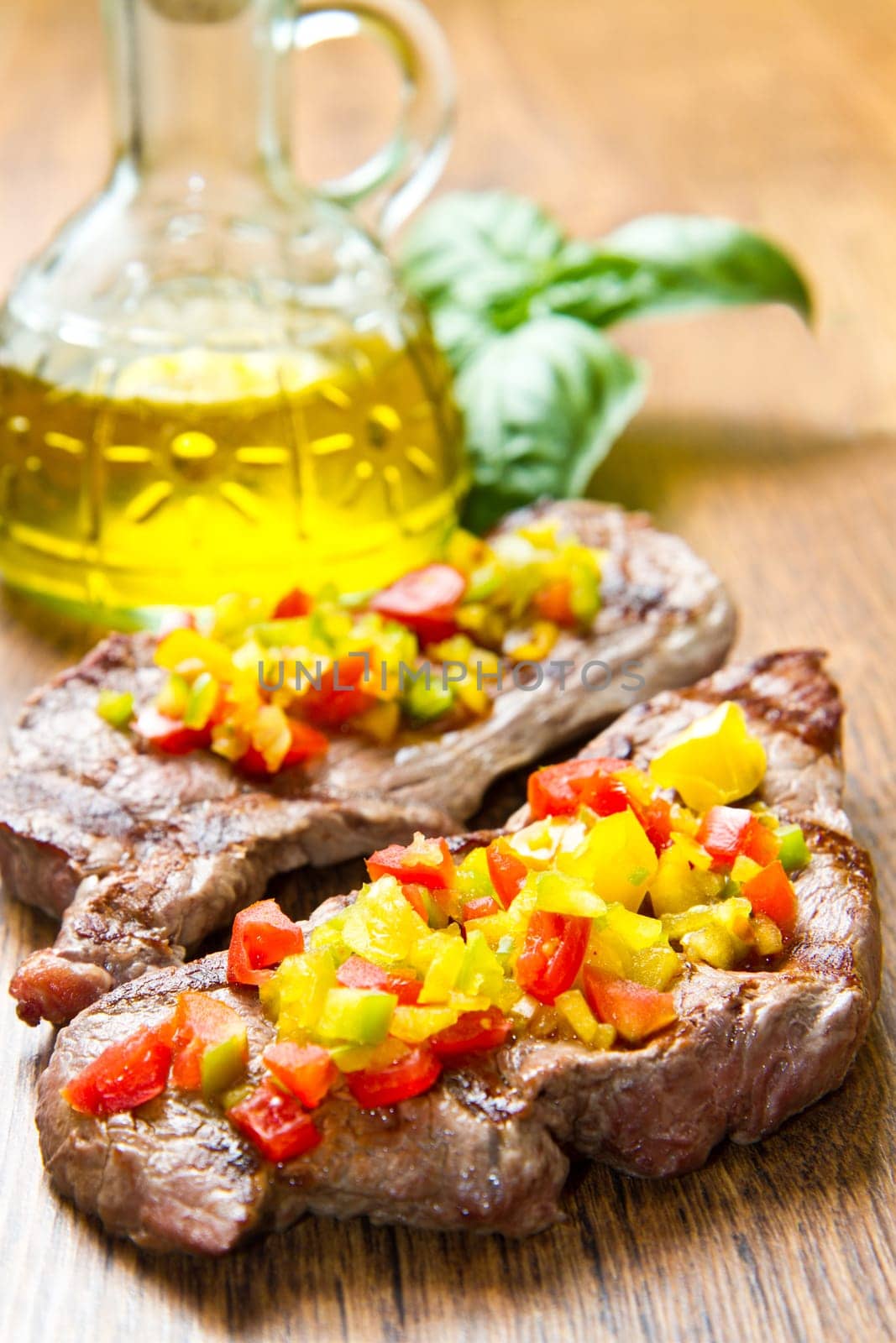 grilled steak meat with cut vegetables
