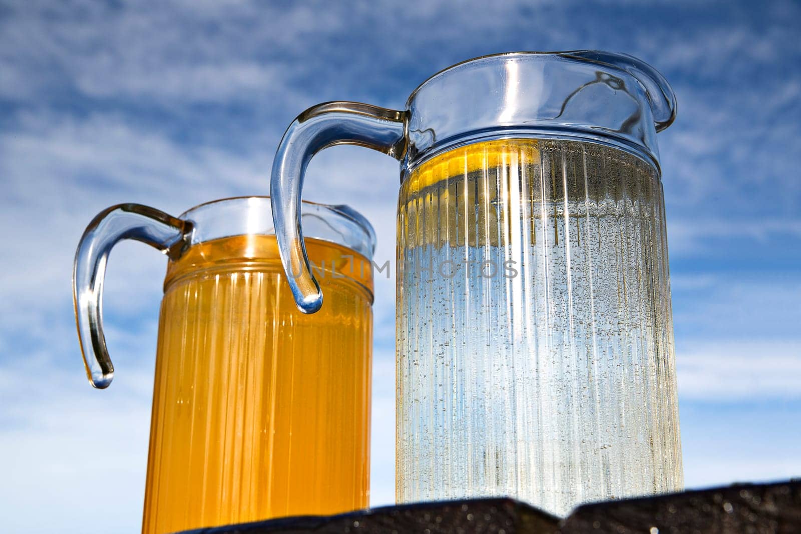 Fresh juice of orange with empty glass container