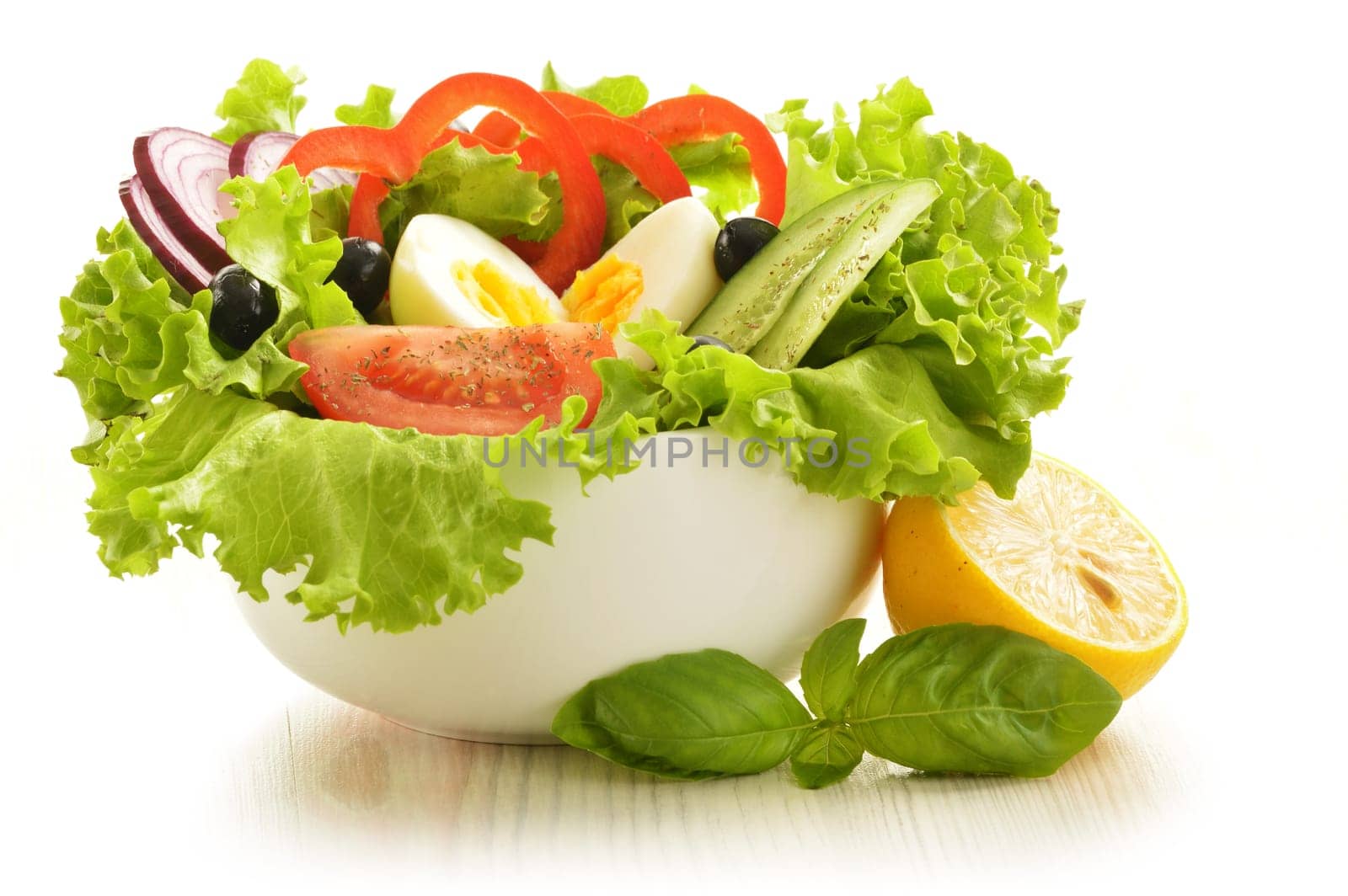 Vegetable salad bowl isolated on white