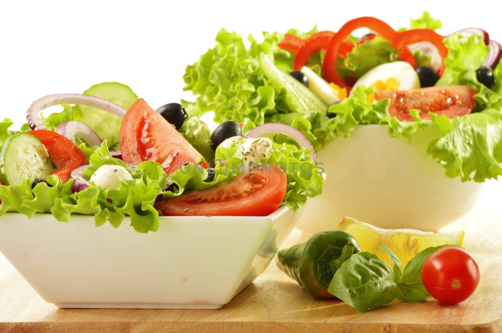 Vegetable salad bowl isolated on white