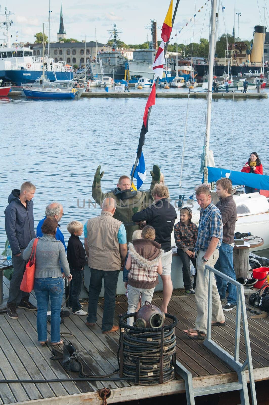 TALLINN, ESTONIA - JULY 14 - Demonstration of immersing of the diver under water at the "Tallinn&#039 s Sea Days 2012"" event, on July 14, 2012 in Tallinn, Estonia."