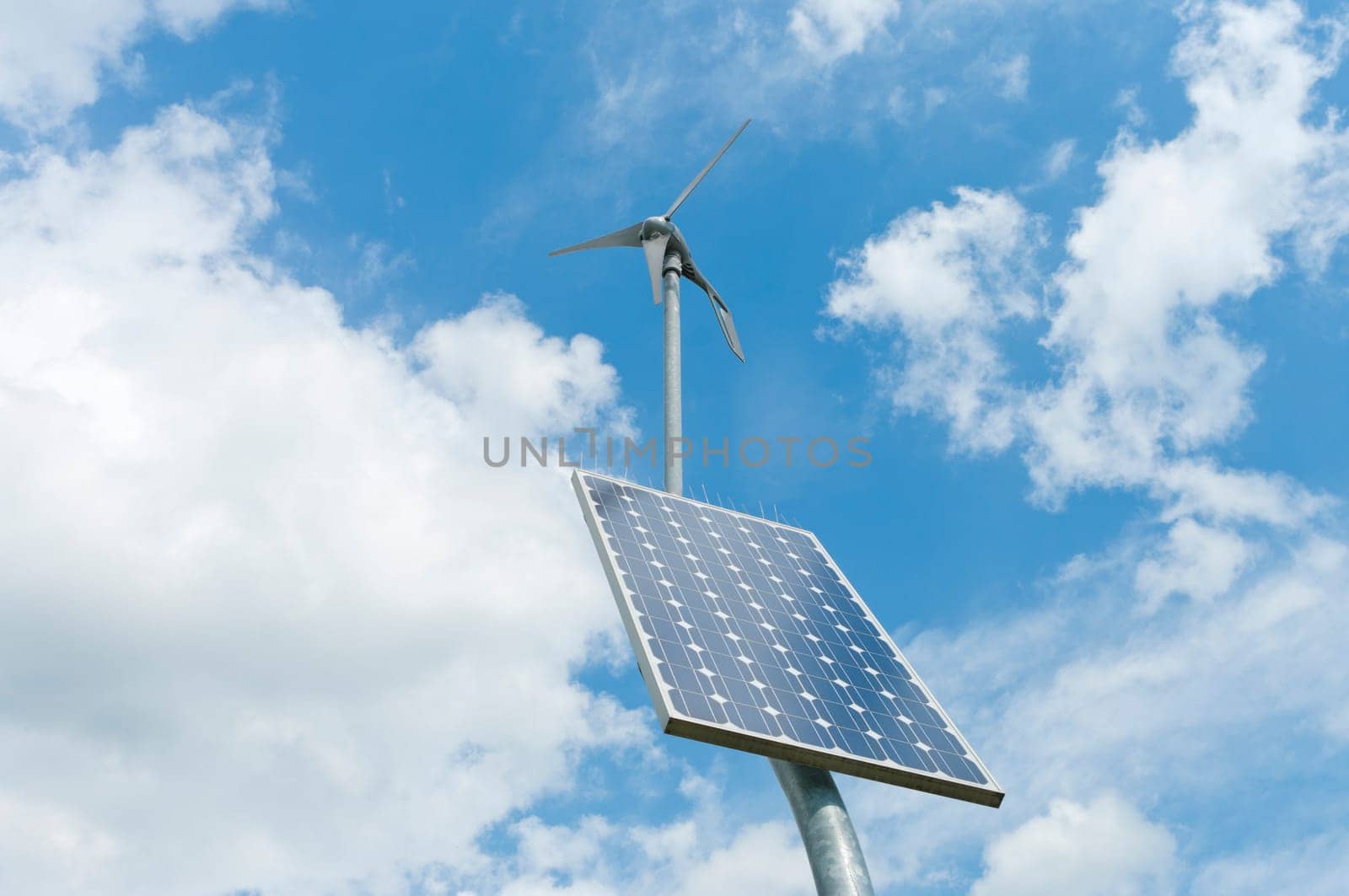 double power supply for an outside measuring instrument by a small solar panel and wind generator