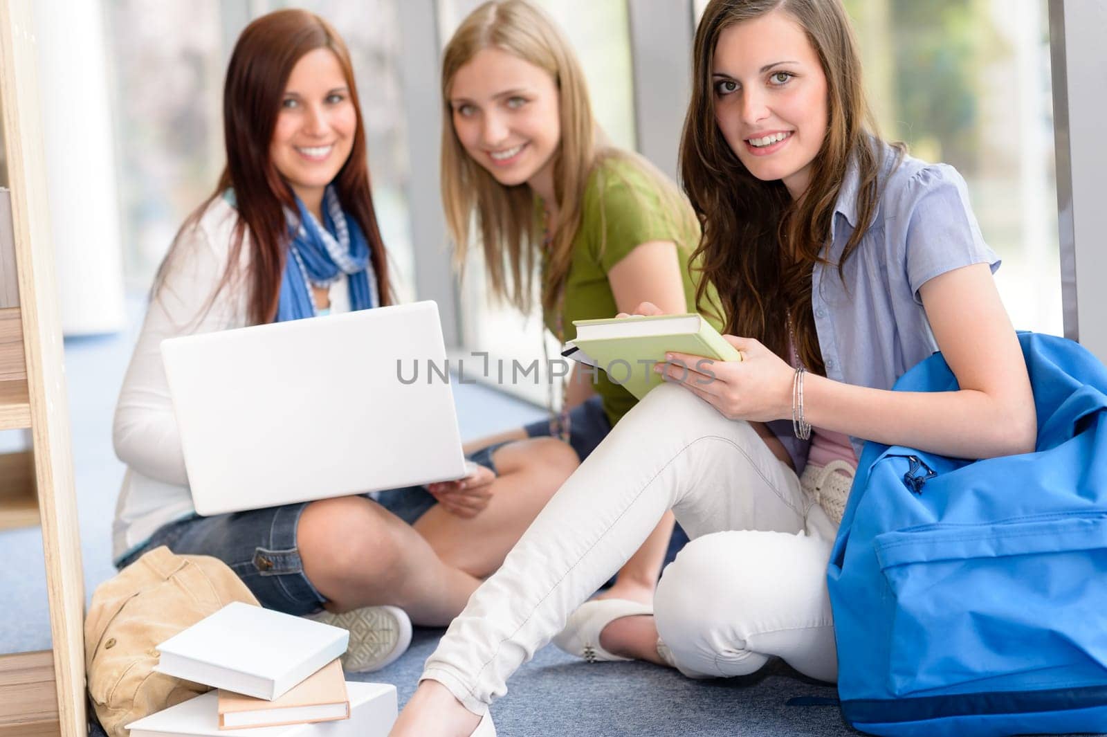 Group of high school students sitting floor self educating