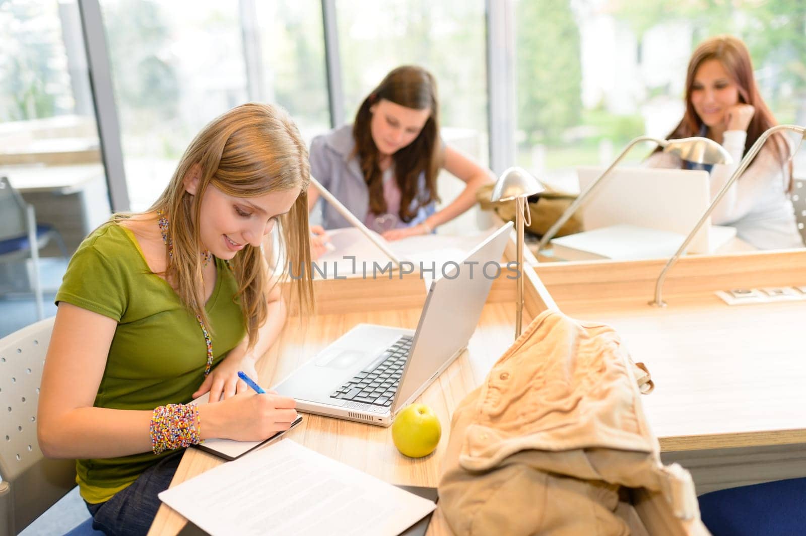Students group working on computer at study room high school