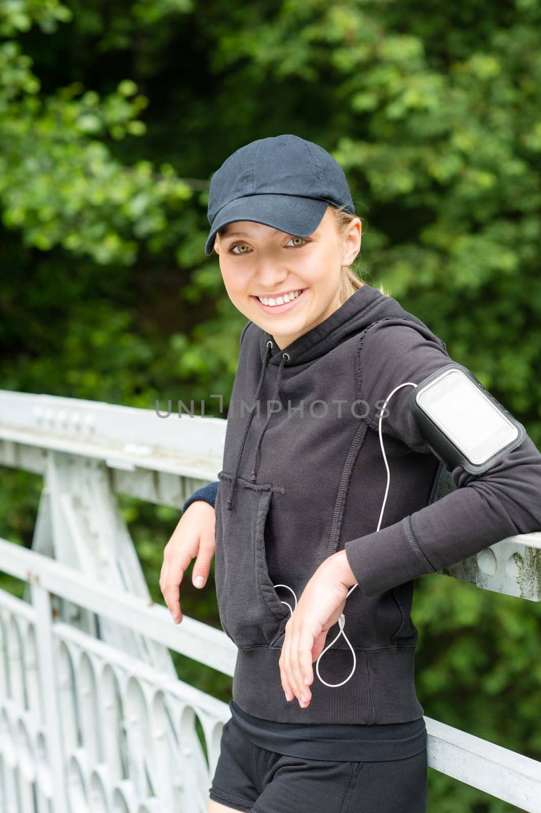 Young woman happy resting after workout sport tired relaxing tracksuit