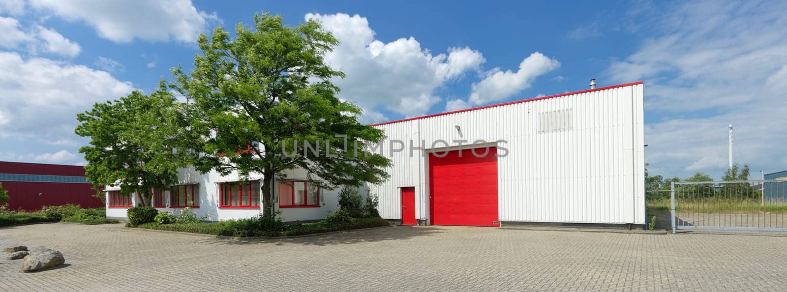industrial warehouse with red roller door