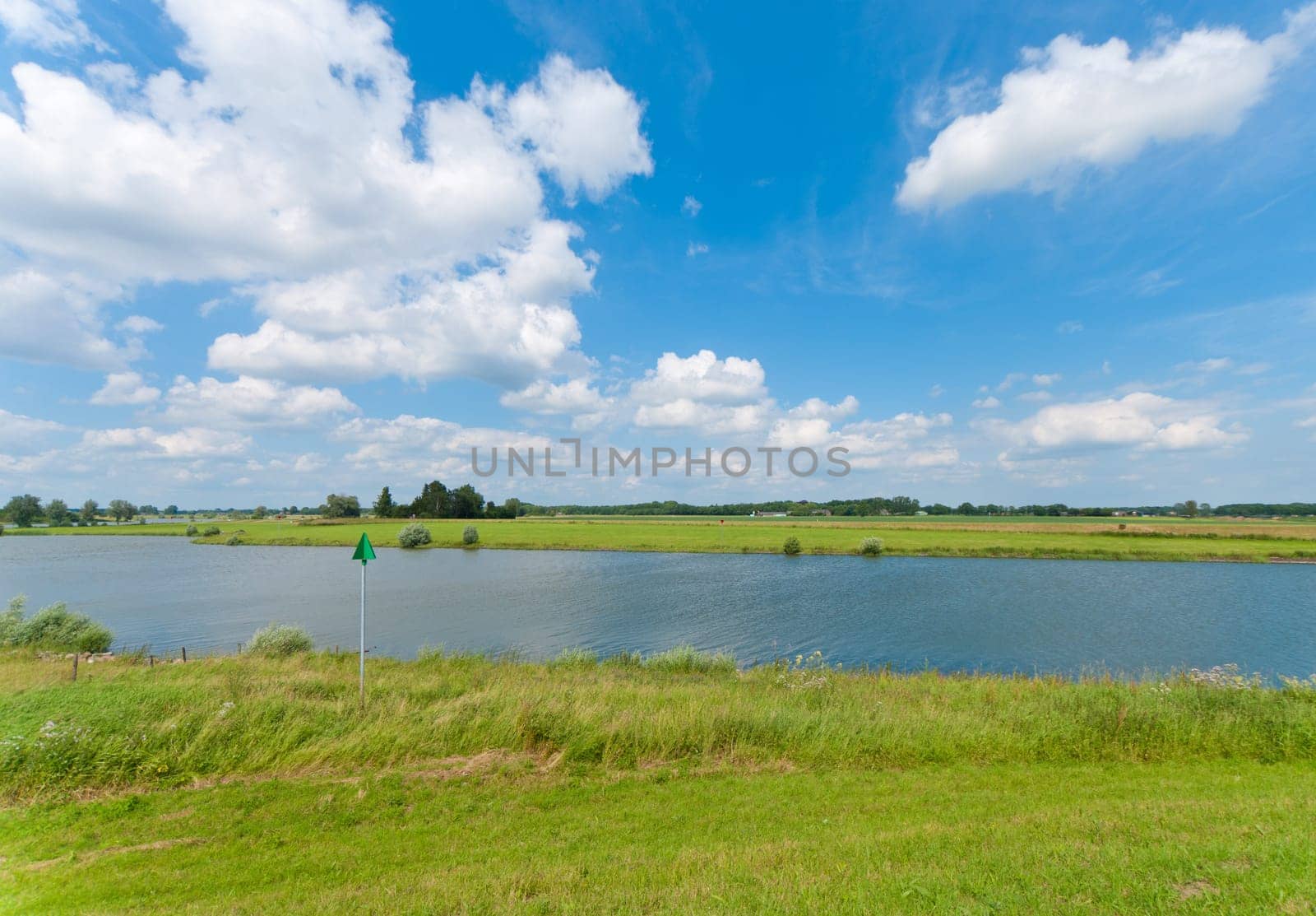 view of a dutch canal under a nice sky