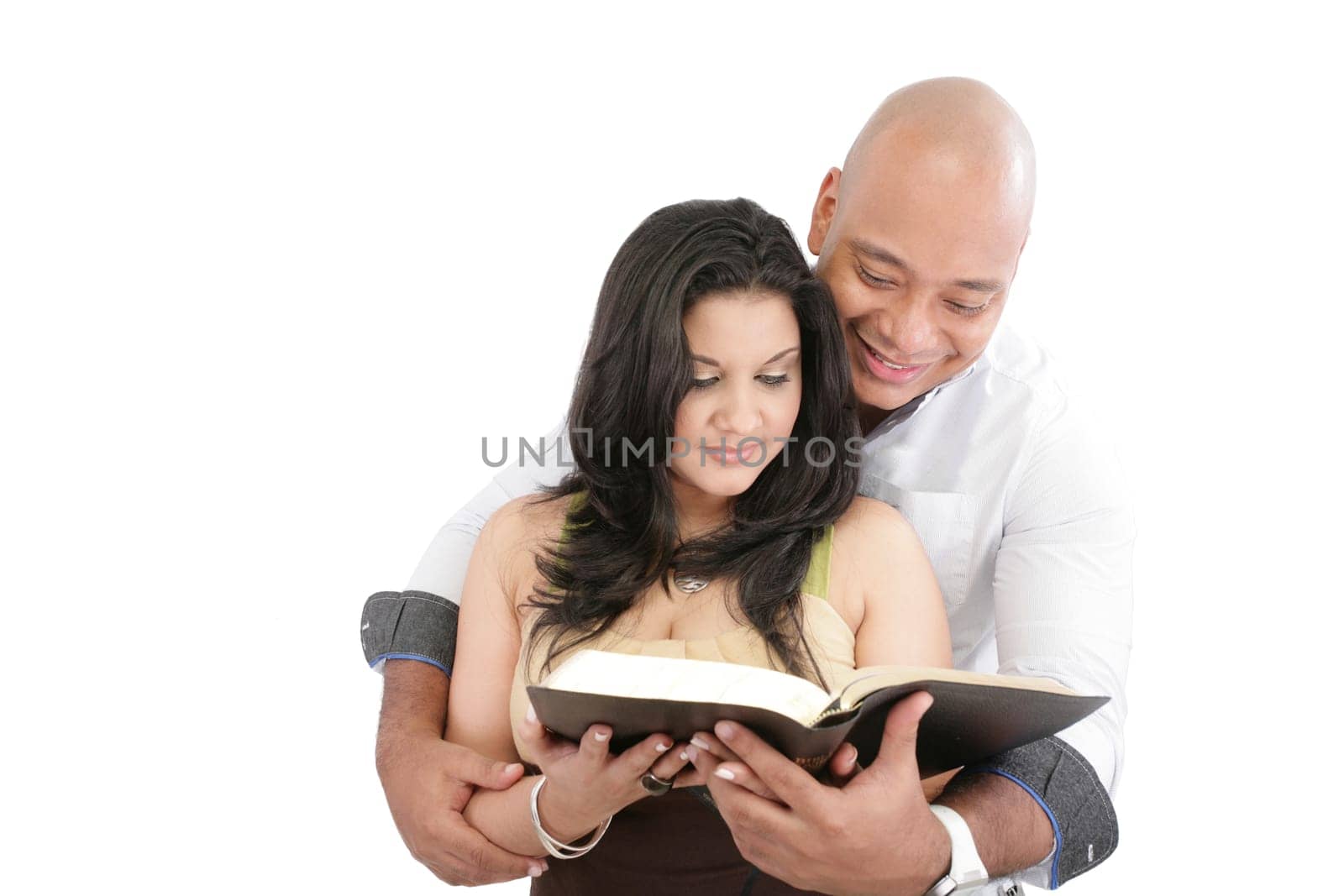 Attractive couple reading the Bible