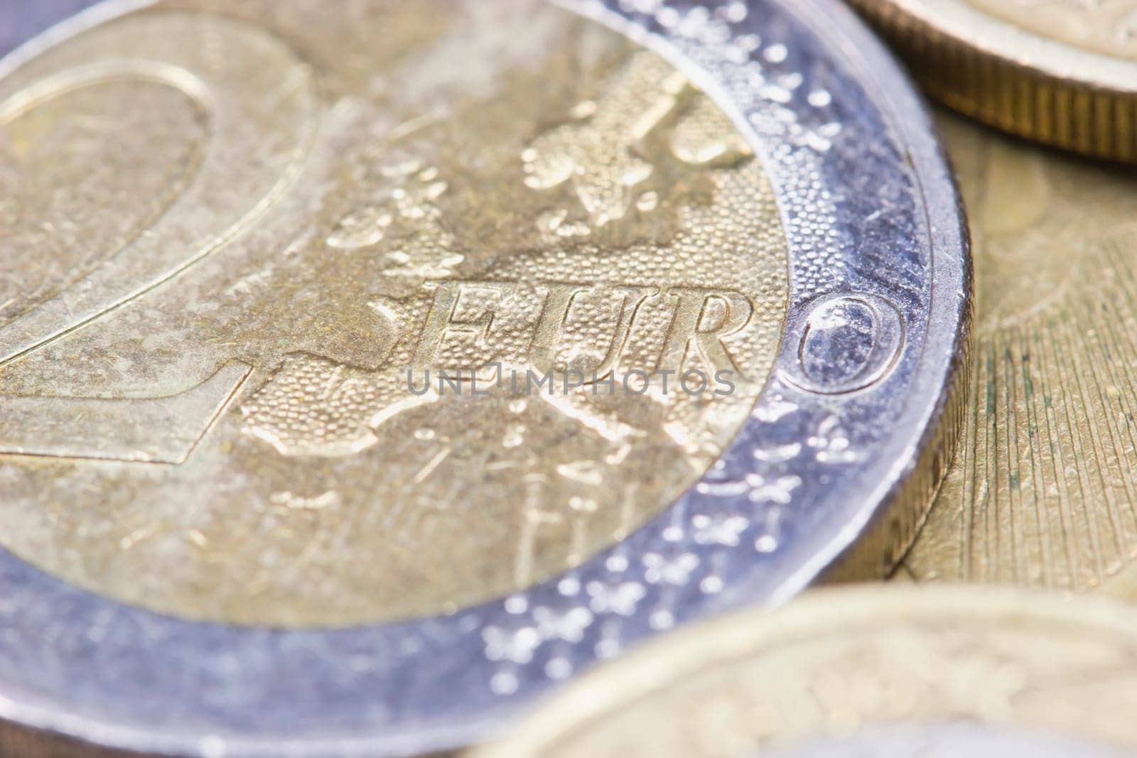 Macro shot of euro coins. Focus on the Euro sign.