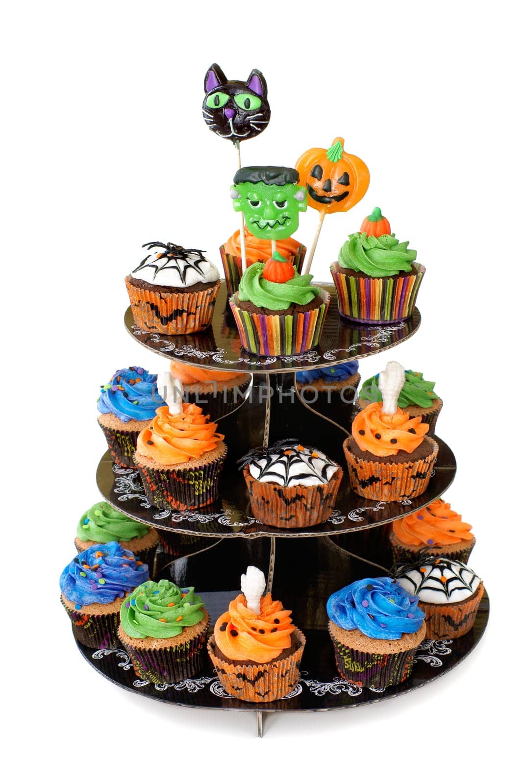 Three tier cupcake stand with lollipops on the top