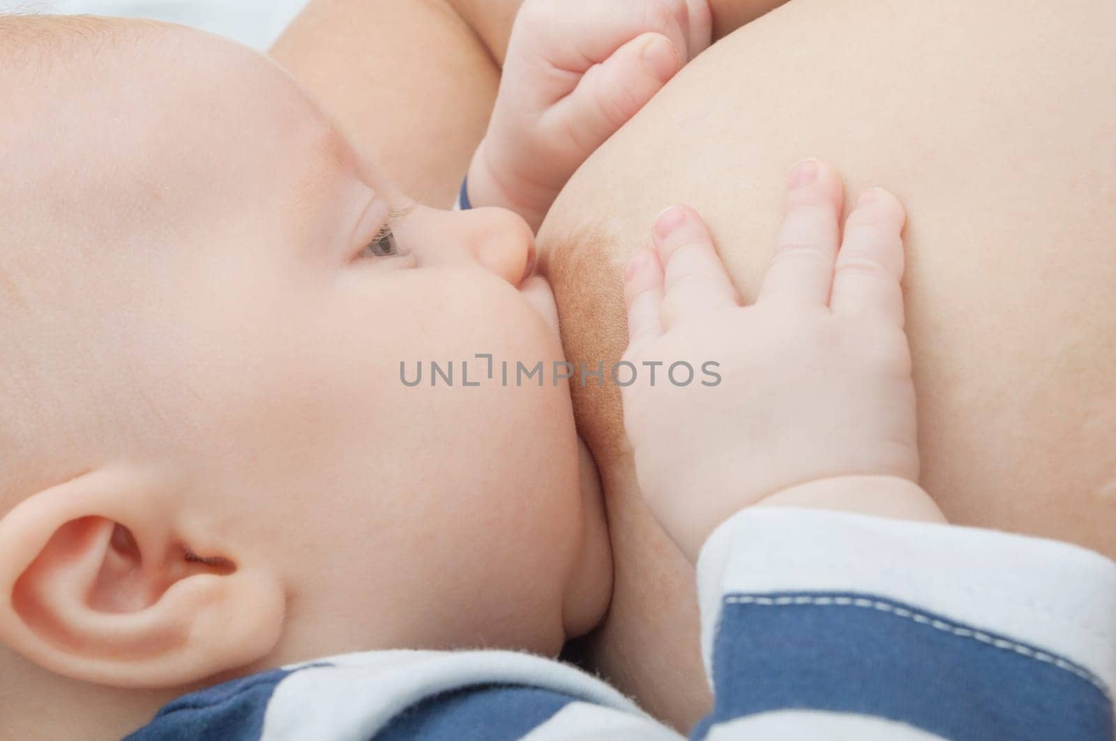 Closeup of Mother Breast Feeding Her Baby