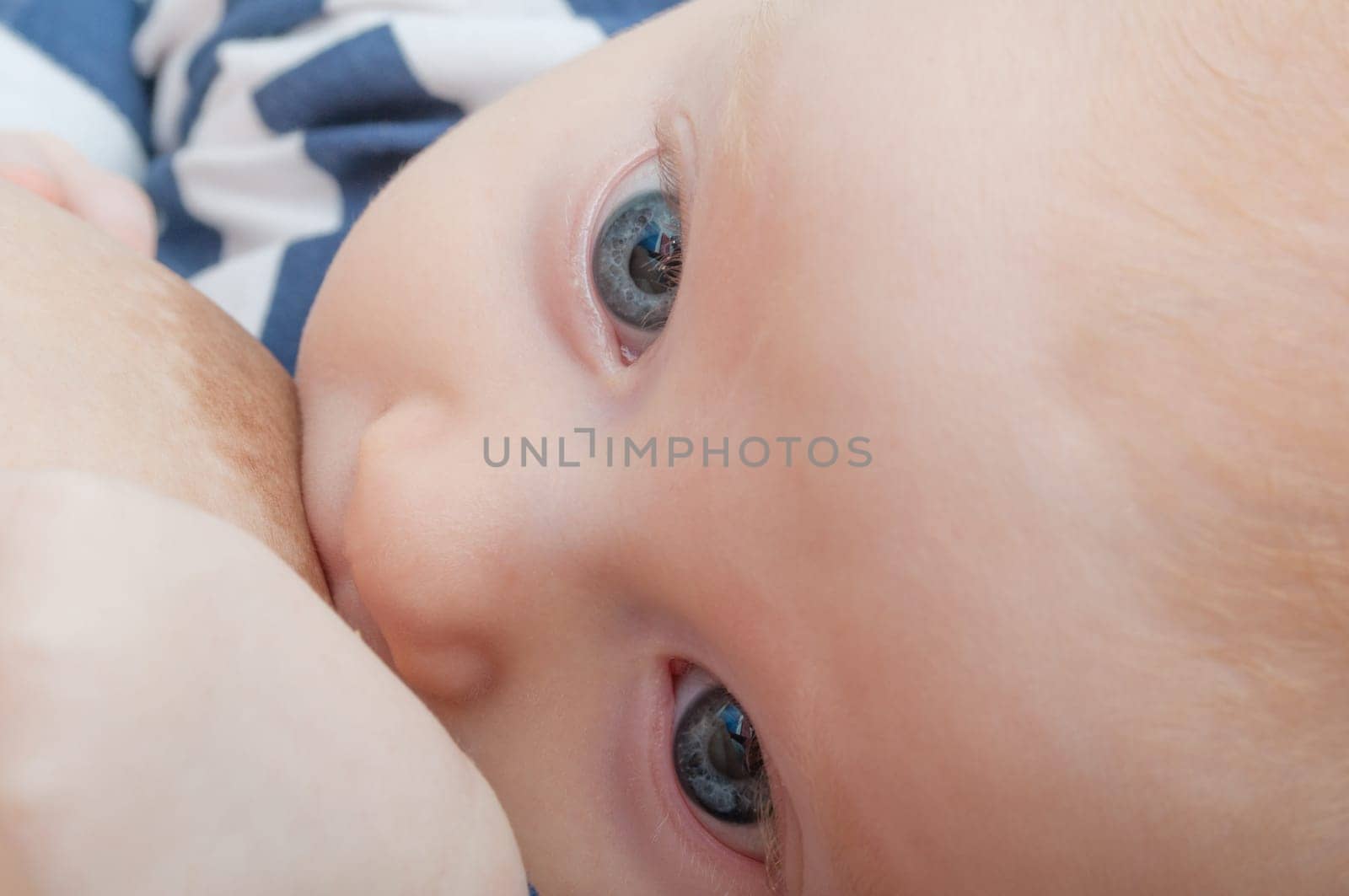 Closeup of Mother Breast Feeding Her Baby