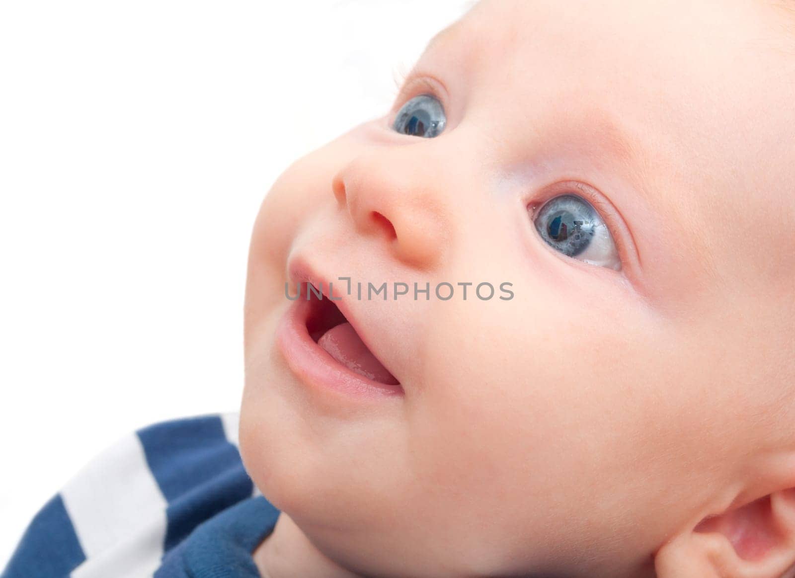 Closeup of Happy Smiling Newborn Baby on White Background