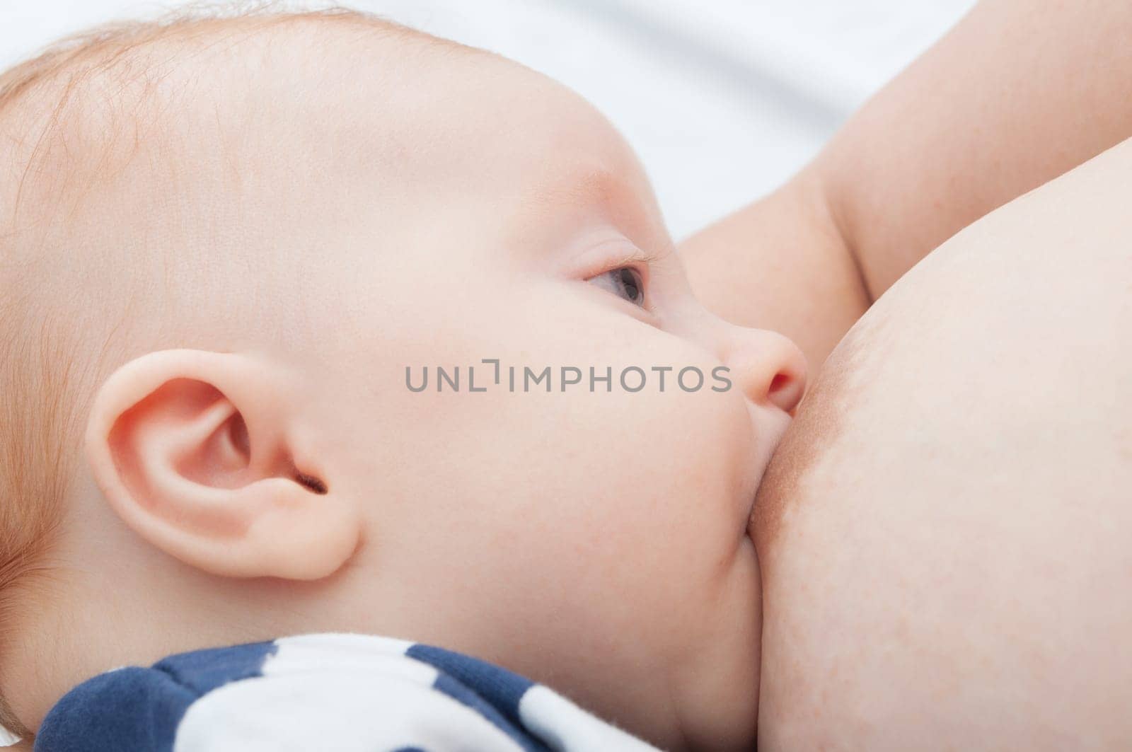 Closeup of Mother Breast Feeding Her Baby