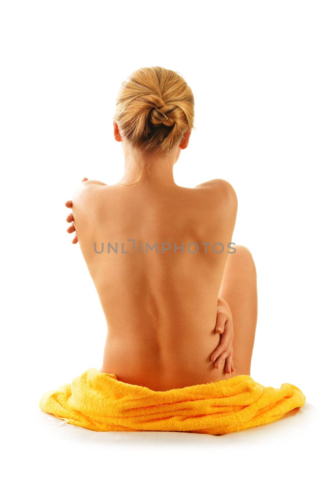 Nude woman with the towel isolated on white