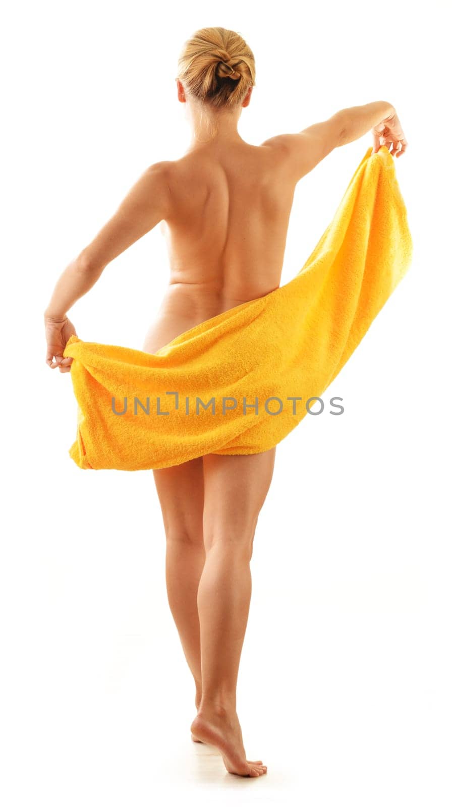 Nude woman with the towel isolated on white