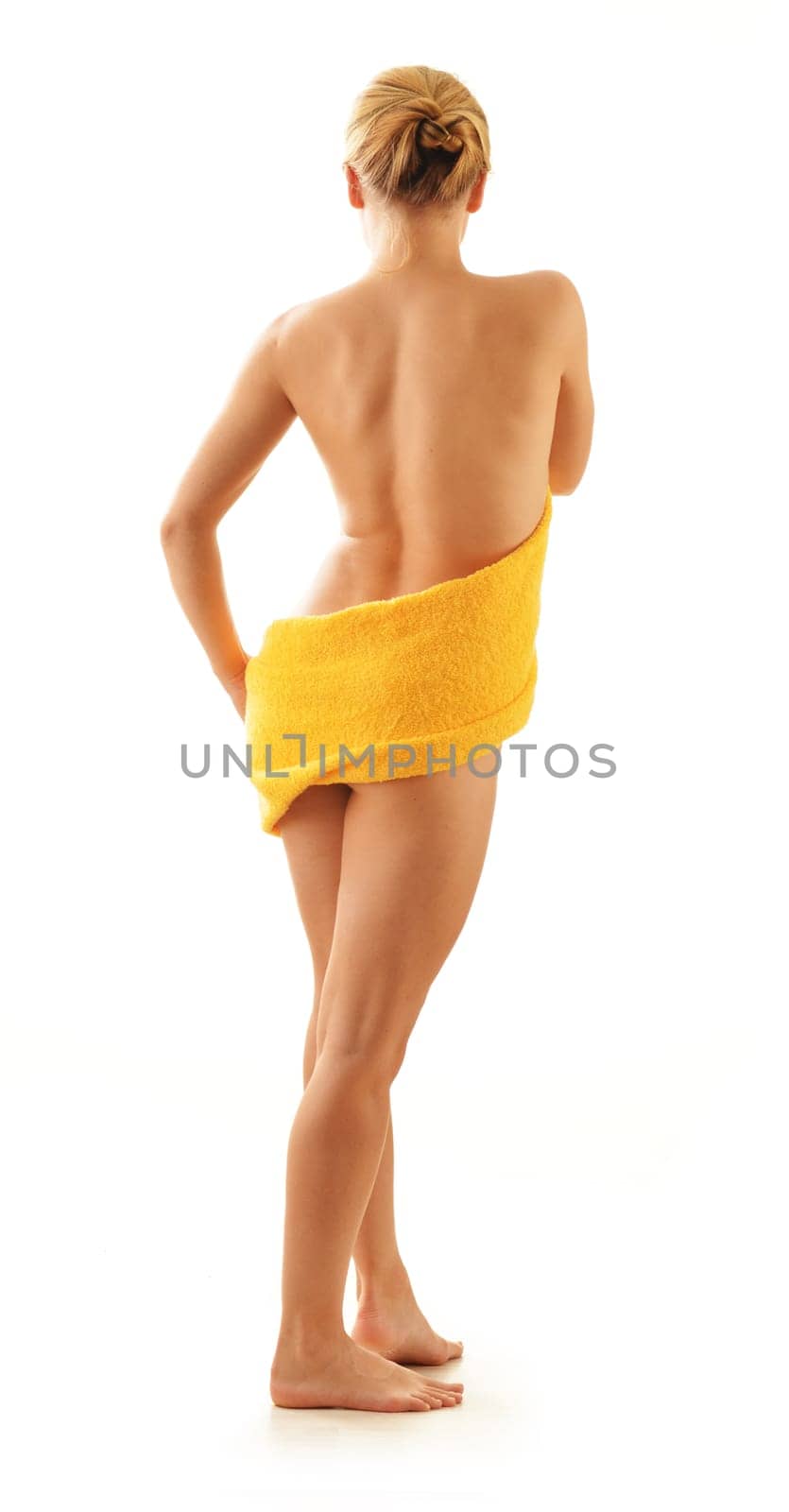 Nude woman with the towel isolated on white