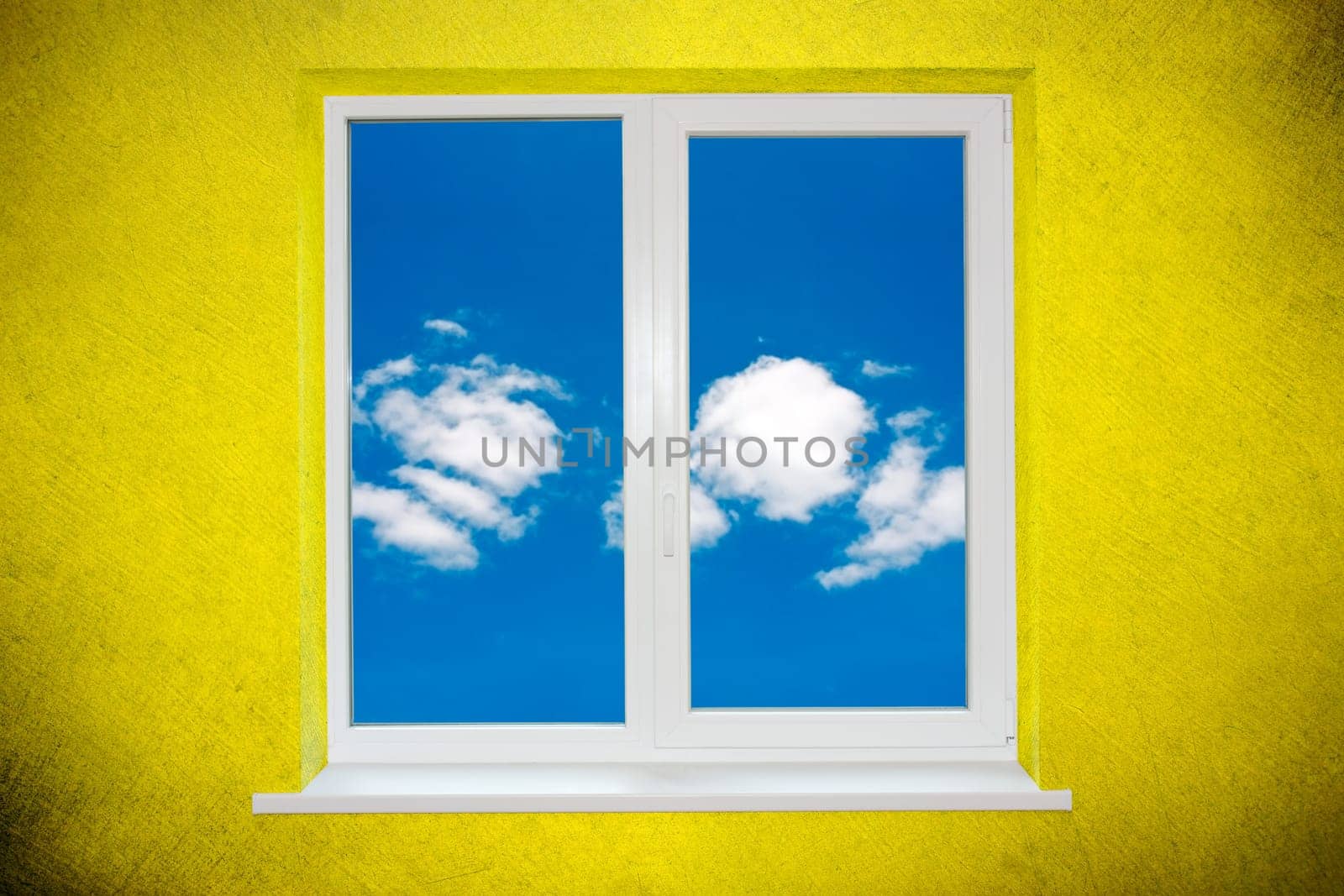 Sky in the window on green painted wall