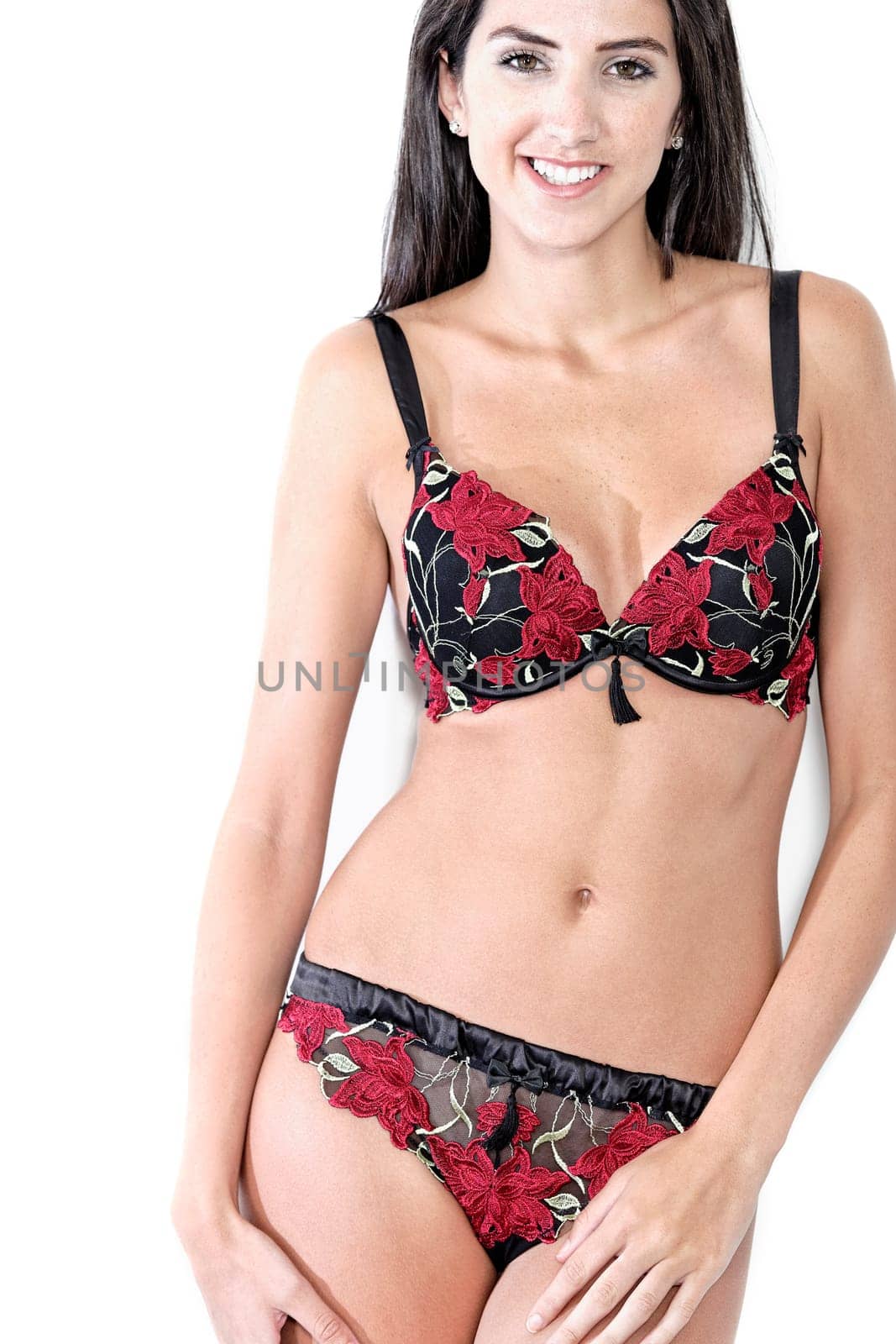 Beautiful young woman in sexy red underwear smiling
