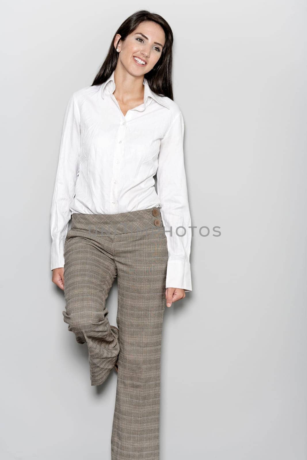 Professional working woman in corporate business trousers and shirt